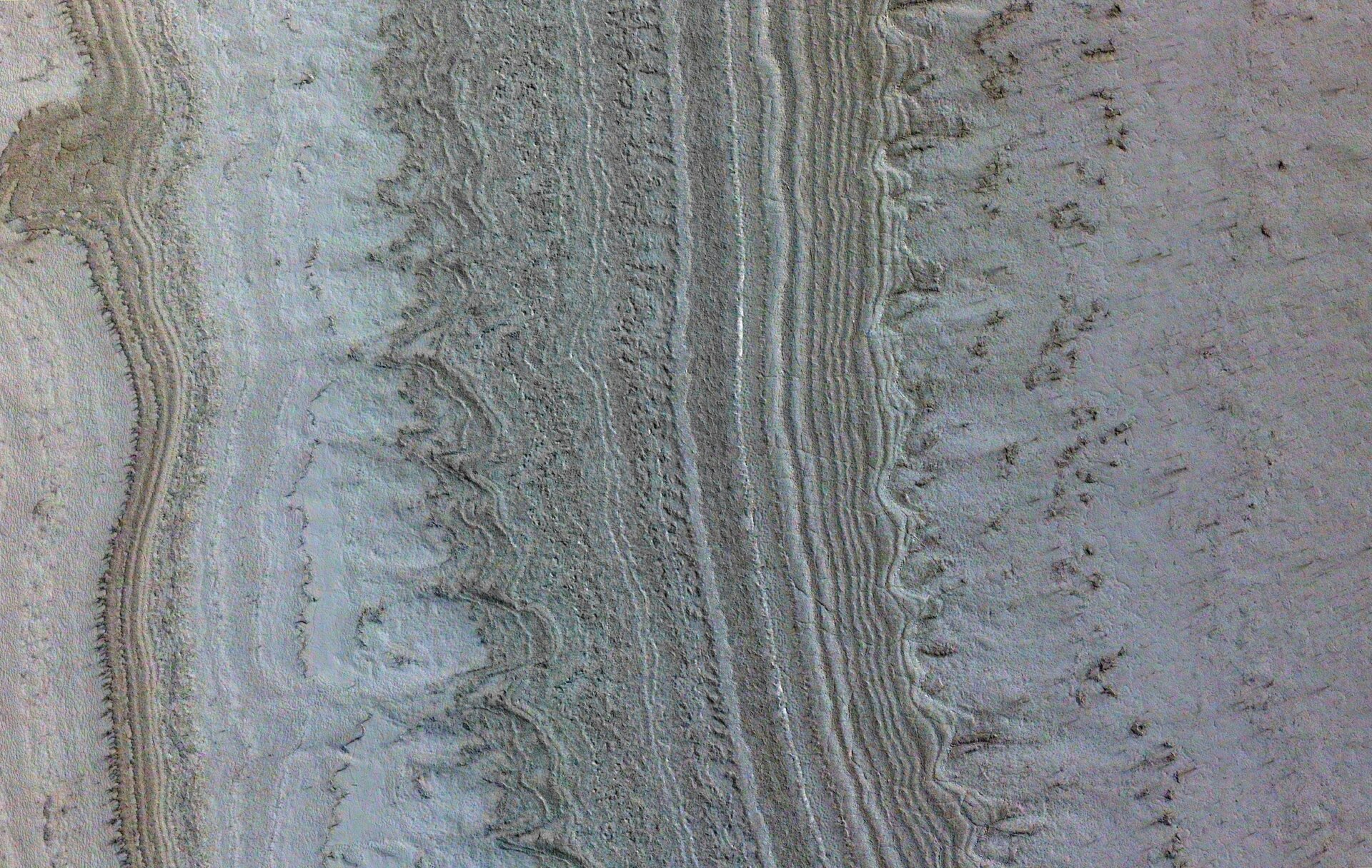 Ice sheets on the Martian south pole imaged by the Mars Reconnaissance Orbiter from 186 miles above Mars.