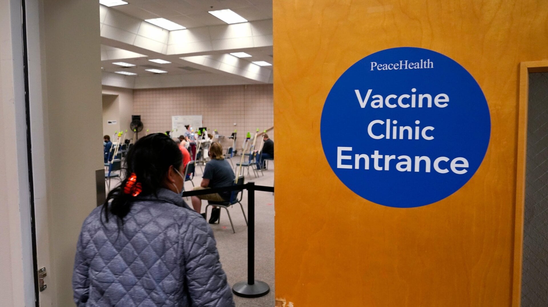 A woman entering a vaccination clinic at PeaceHealth St. Joseph Medical Center Thursday, June 3, 2021, in Bellingham, Washington