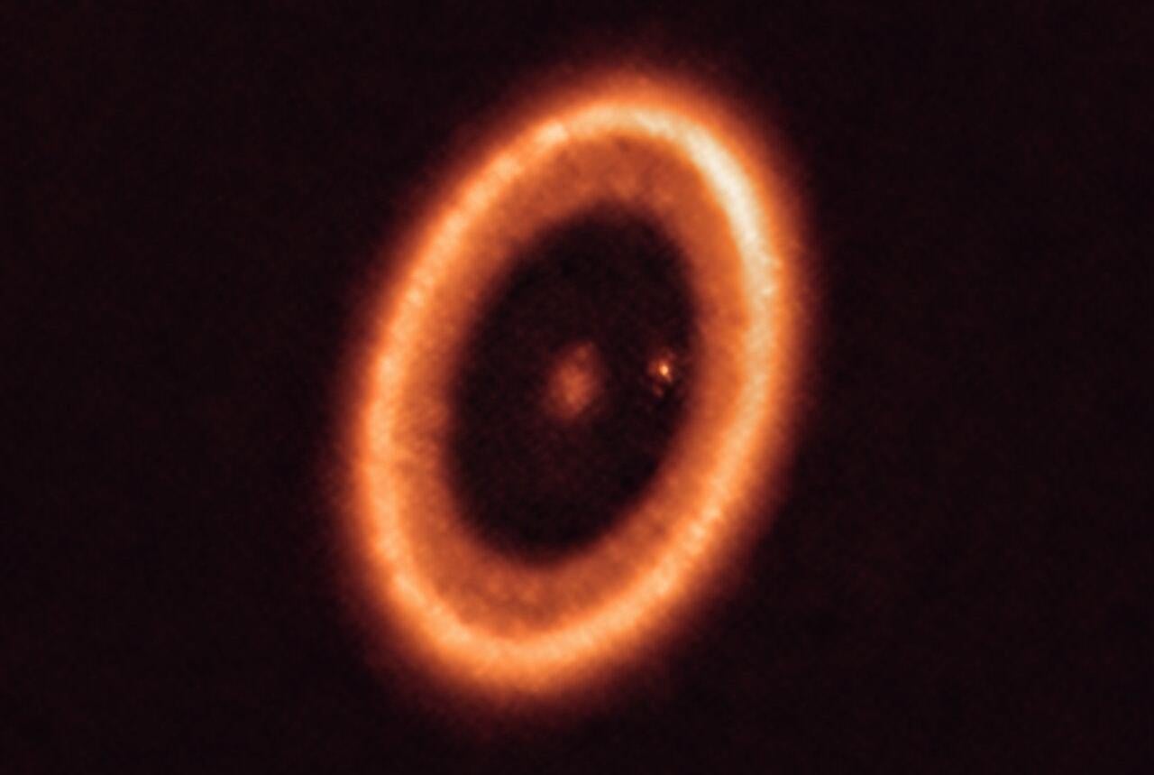 The PDS 70 system as imaged by ALMA. It shows the donut-like circumstellar disk surrounding the host star, and the protoplanet tucked away along the inside right. 