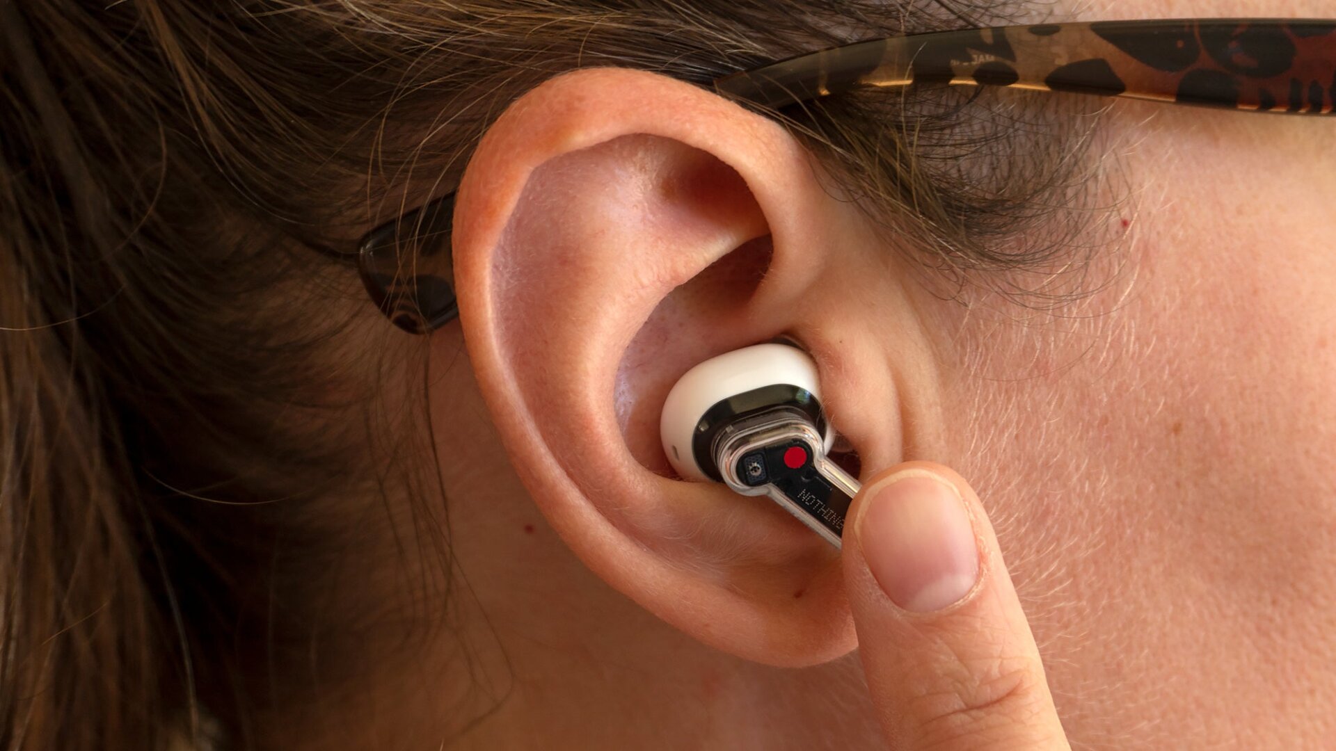 The stem features touch controls on the flat side. Sliding your finger up and down increases and decreases volume, but there are tap controls as well for controlling music playback and quick access to other functions.