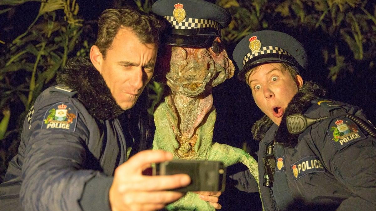 Mike Minogue and Karen O’Leary (and an alien friend) in “Cop Circles,” the second episode of Wellington Paranormal.
