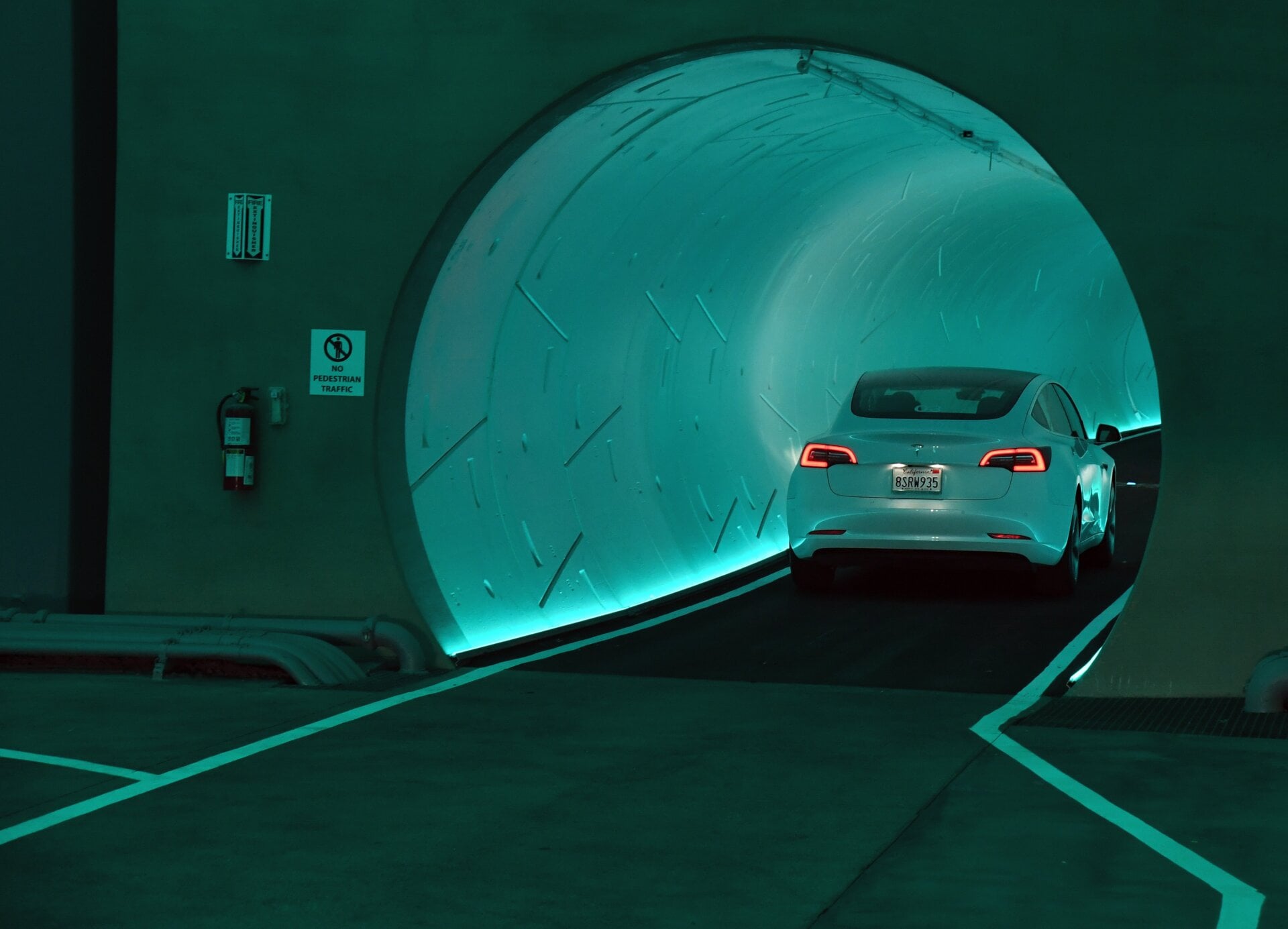 A Tesla car drives through a tunnel in the Central Station during a media preview of the Las Vegas Convention Center Loop on April 9, 2021 in Las Vegas, Nevada.