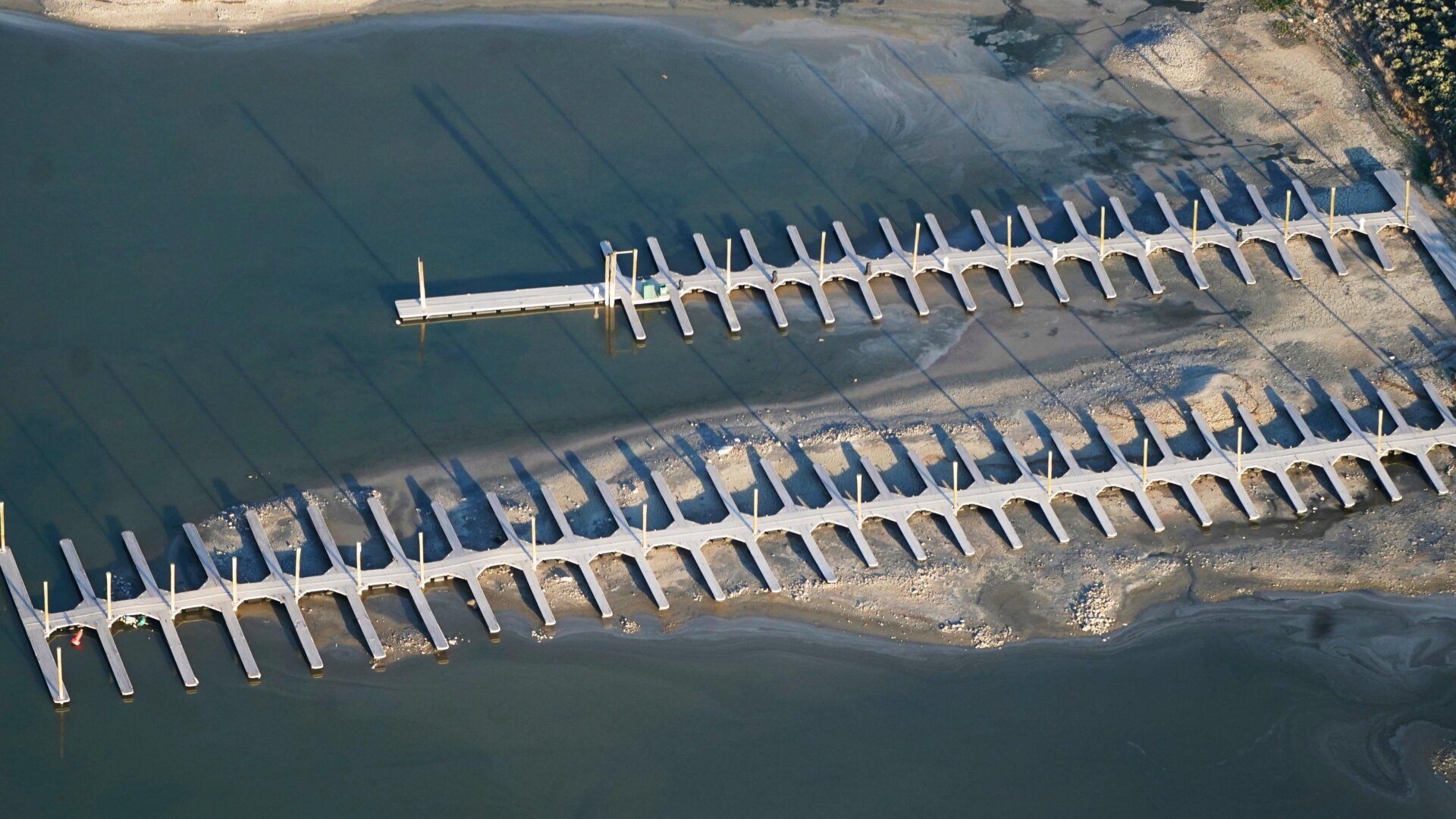 Docks at the state park on Great Salt Lake’s Antelope Island, seen here exposed far above the waterline in May 2021.