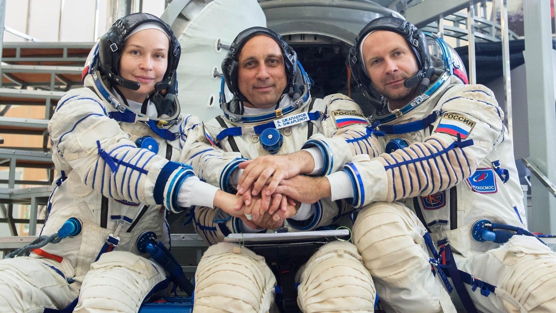 Members of the ISS-66 mission. From left to right: actor Yulia Peresild, commander Anton Shkaplerov, and film director Klim Shipenko.