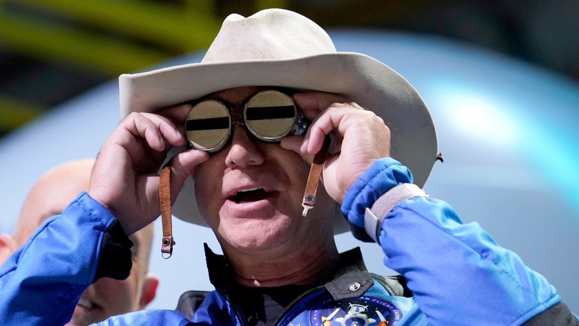 Blue Origin founder Jeff Bezos donning aviator glasses that once belonged to aviator Amelia Earhart.