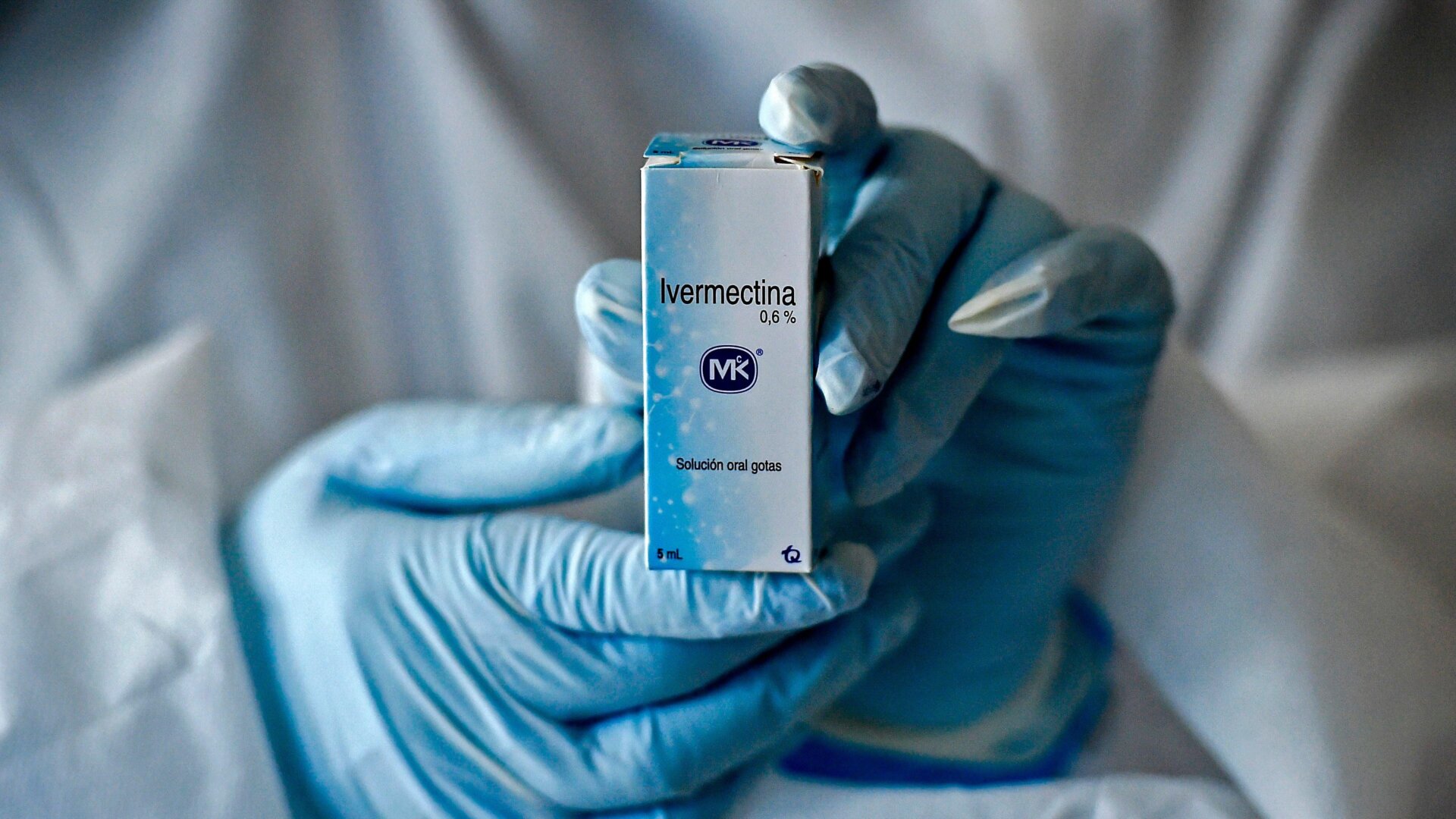 A health worker shows a box of Ivermectin, meant to be used in a trial that took place last year of patients with mild covid-19 in Cali, Colombia. The trial ultimately found nobenefit.
