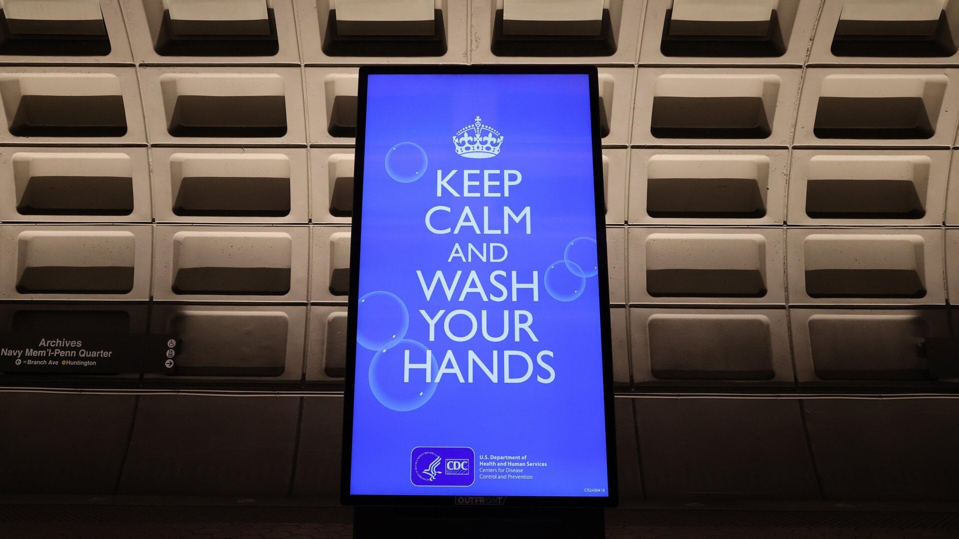 An electronic billboard flashes instructions on the train platform at the Archives station in Washington D.C. on March 25, 2020.