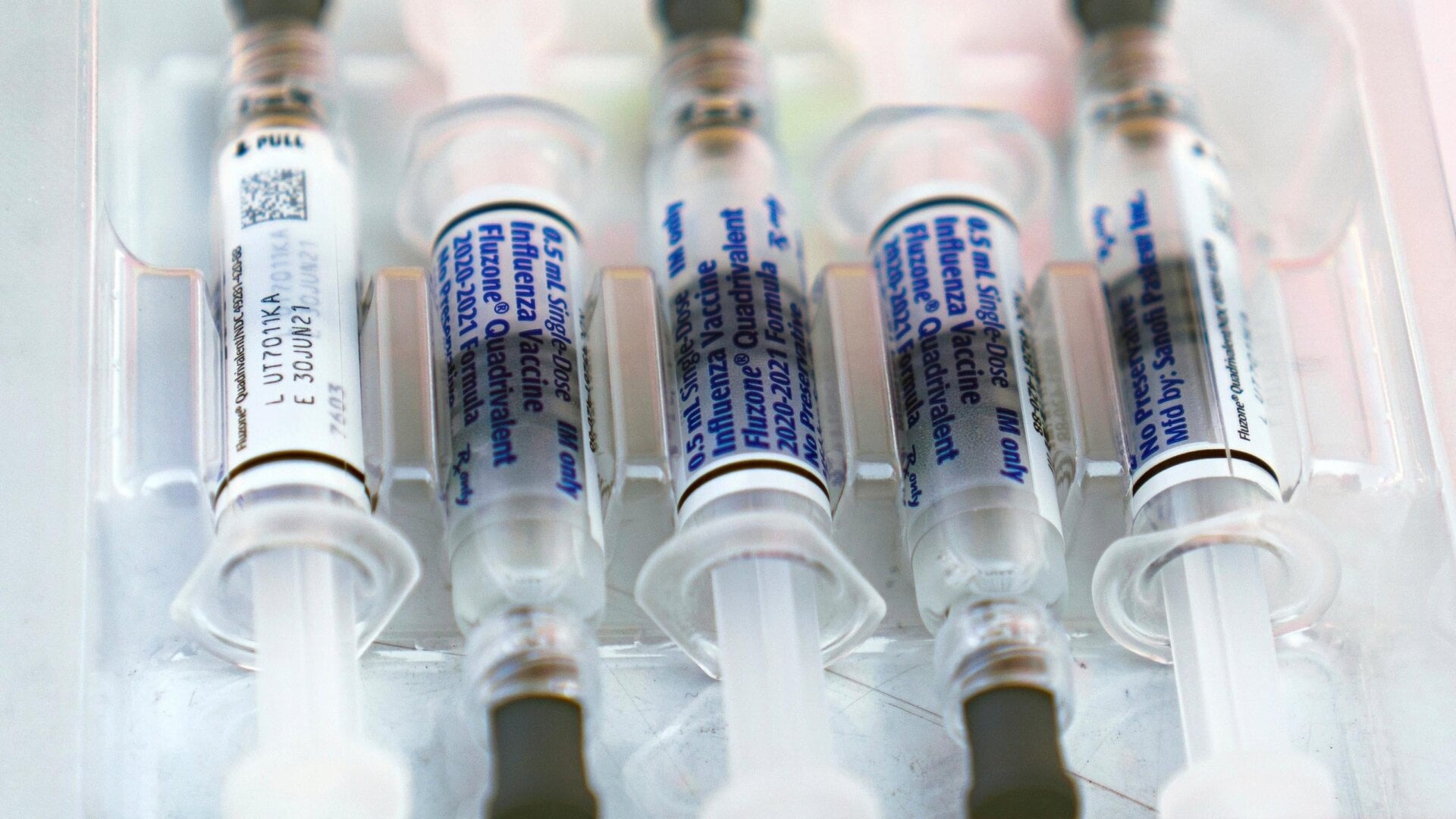 Syringes of influenza vaccine about to be used at a free vaccine drive last year in Los Angeles.