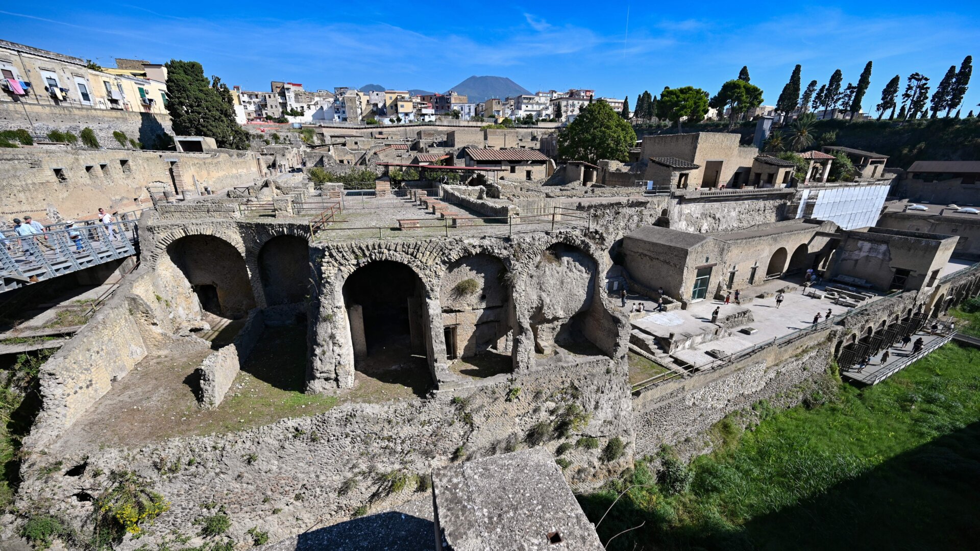 Remains of the ancient Roman town Herculaneum, with Mt. Vesuvius in the background, in 2019.
