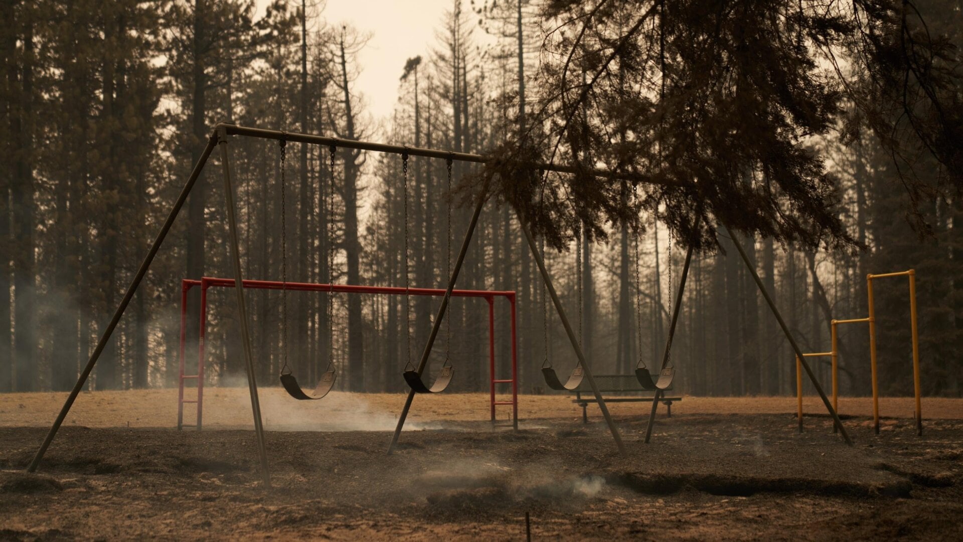 A partially burnt playground still smolders at Walt Tyler Elementary School in Grizzly Flats, California.