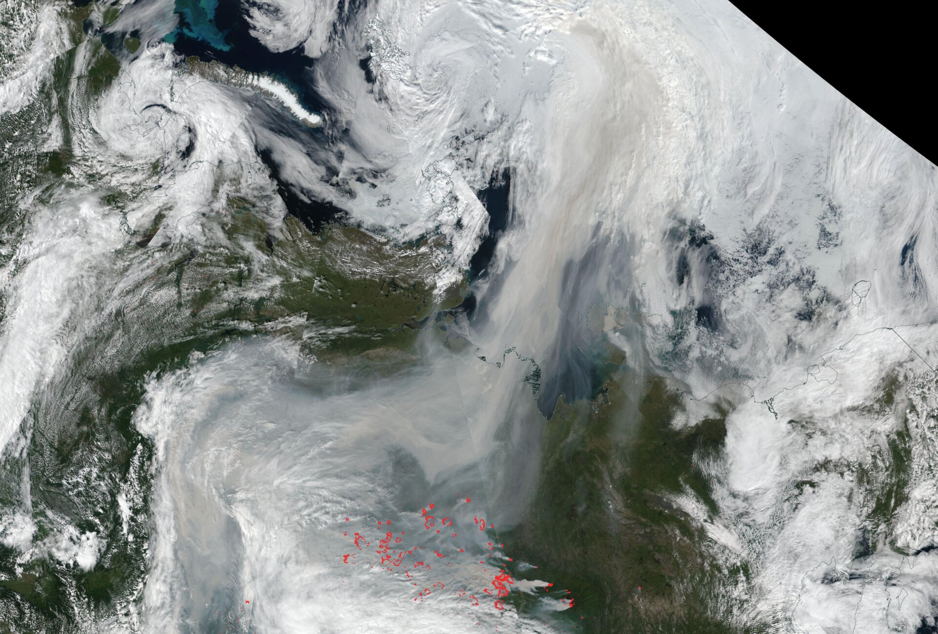 A satellite image from August 2, 2021 showing fire hot spots and the smoke plume stretching from Russia to the North Pole.
