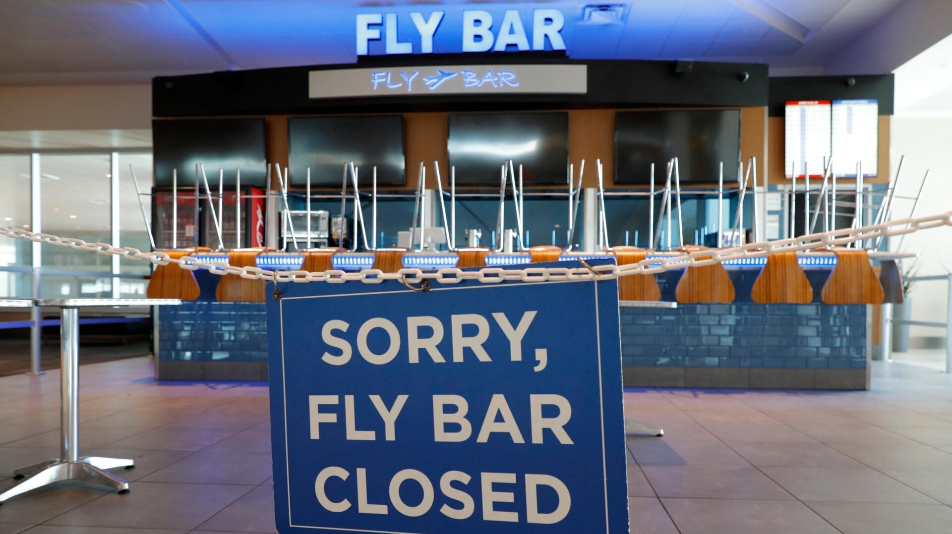 A sign informing passengers that the Fly Bar at Dallas’s Love Field Airport is closed in June 2020; used here as stock photo.