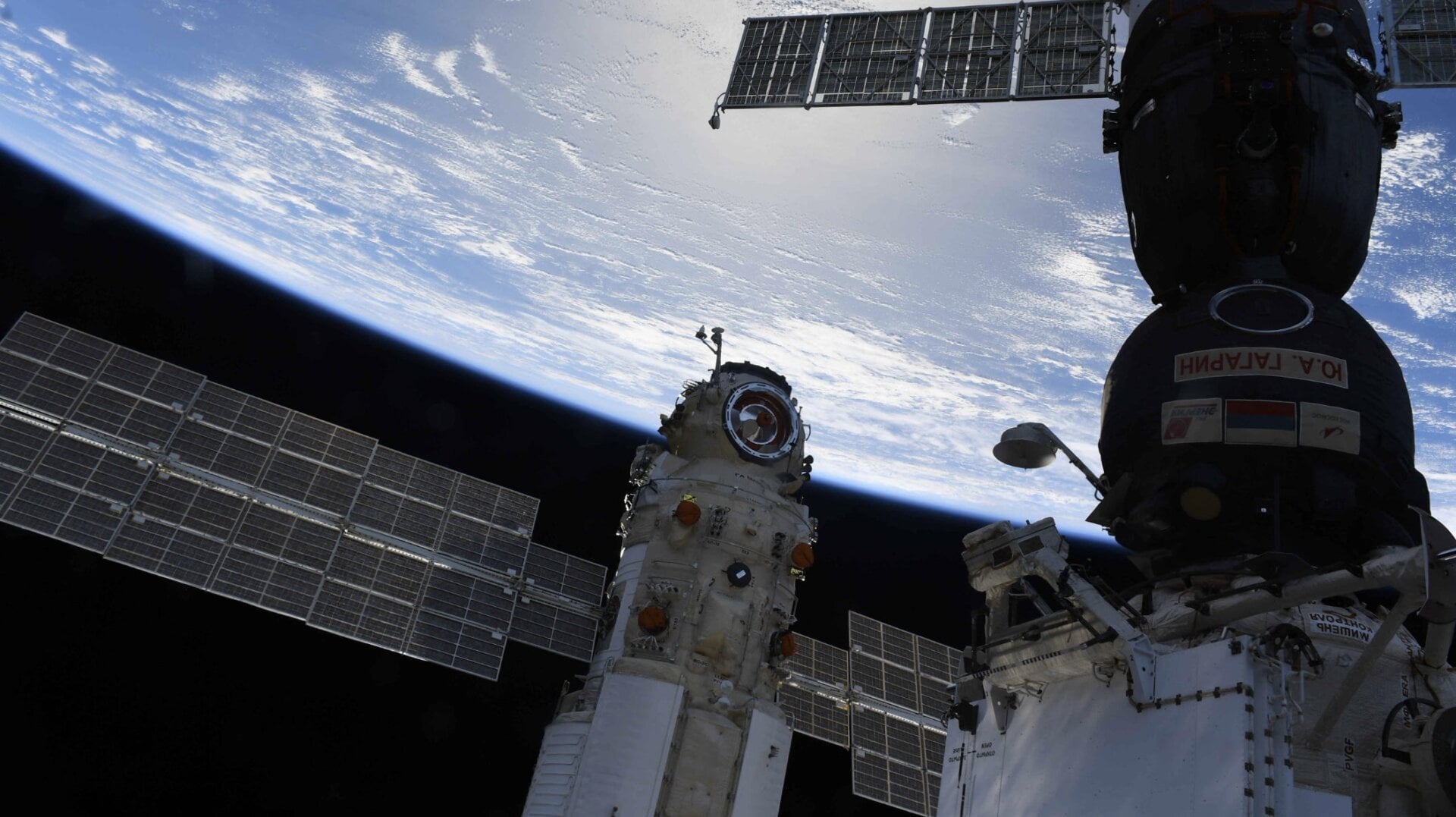 The Nauka module next to a Soyuz spacecraft.