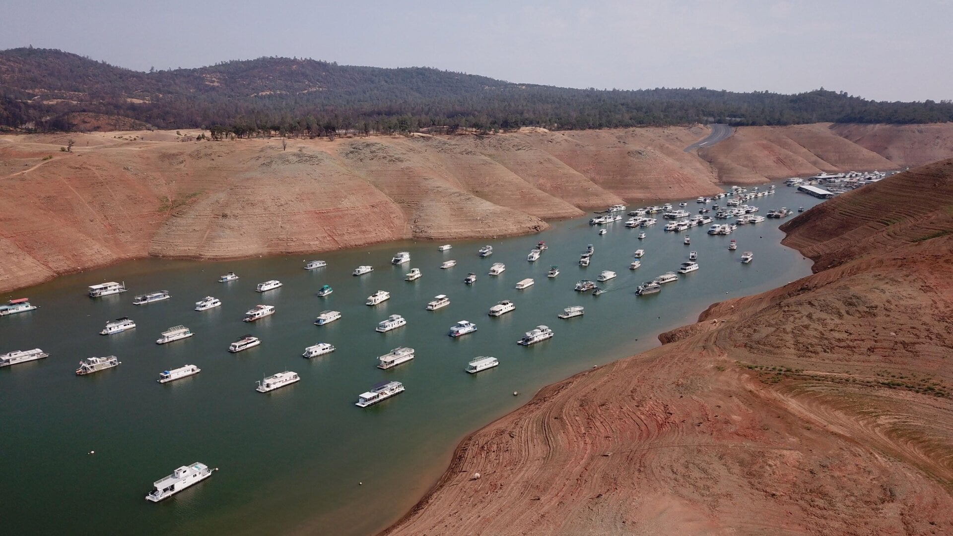 Houseboats sit in low water on Lake Oroville as California’s drought emergency worsens.
