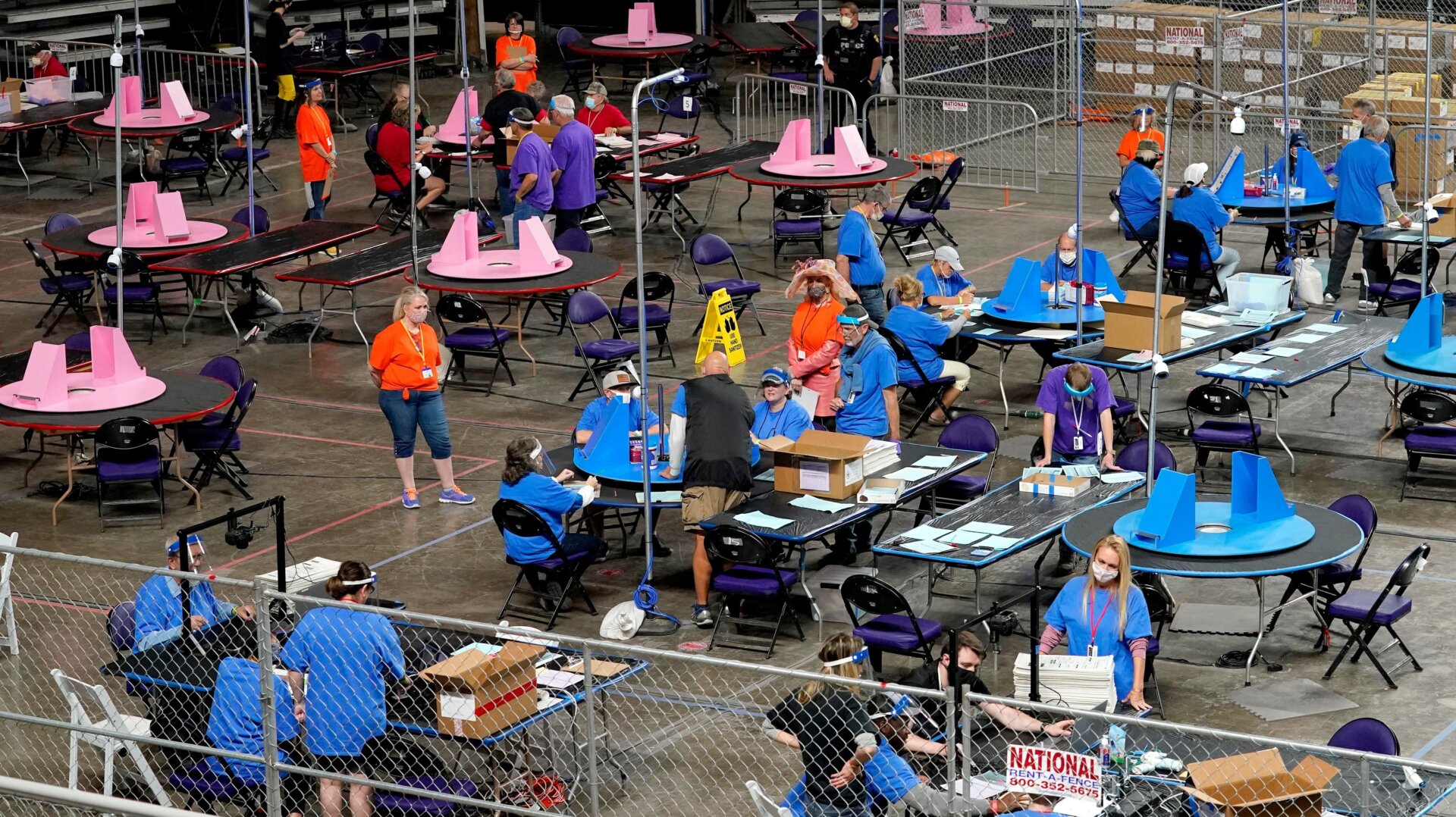 Contractors hired by Cyber Ninjas examine ballots in Maricopa County, May 6, 2021.