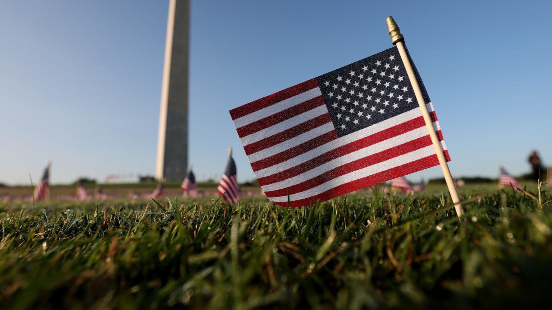 American flags at a COVID Memorial Project installation of 20,000 flags are shown on the National Mall as the United States crossed the 200,000 lives lost in the pandemic September 22, 2020 in Washington, DC.