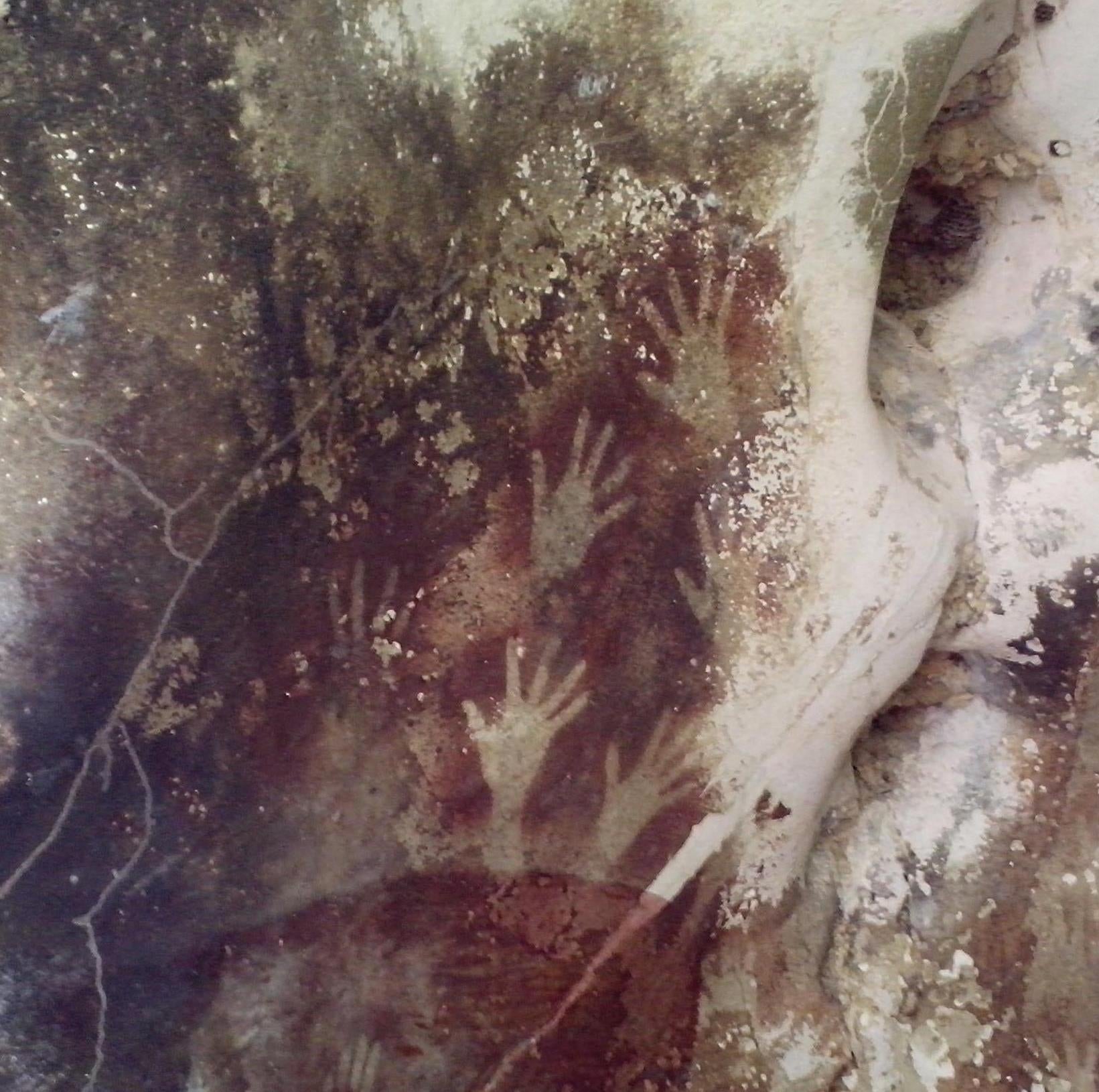 Hand stencils in Pettakere Cave elsewhere on Sulawesi.