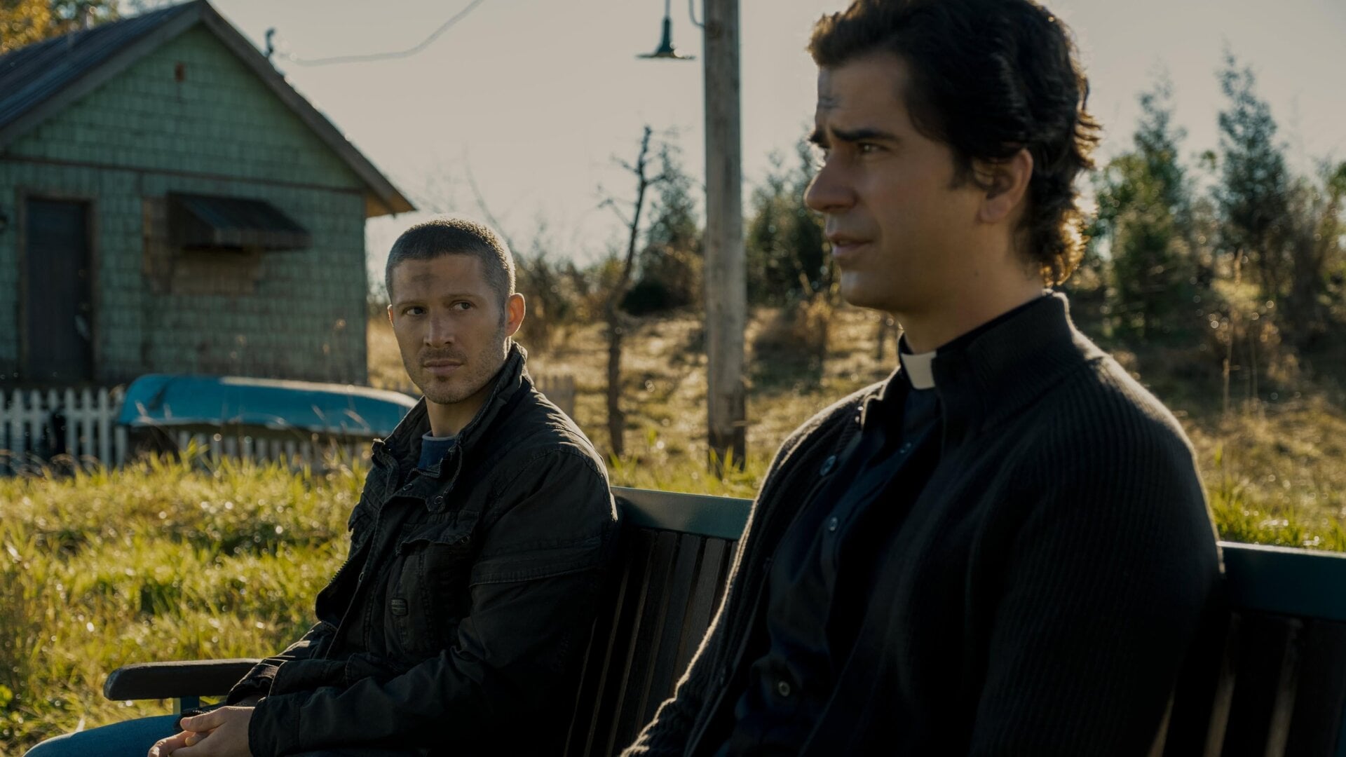 Riley Flynn (Zach Gilford) and Father Paul (Hamish Linklater) in Midnight Mass.