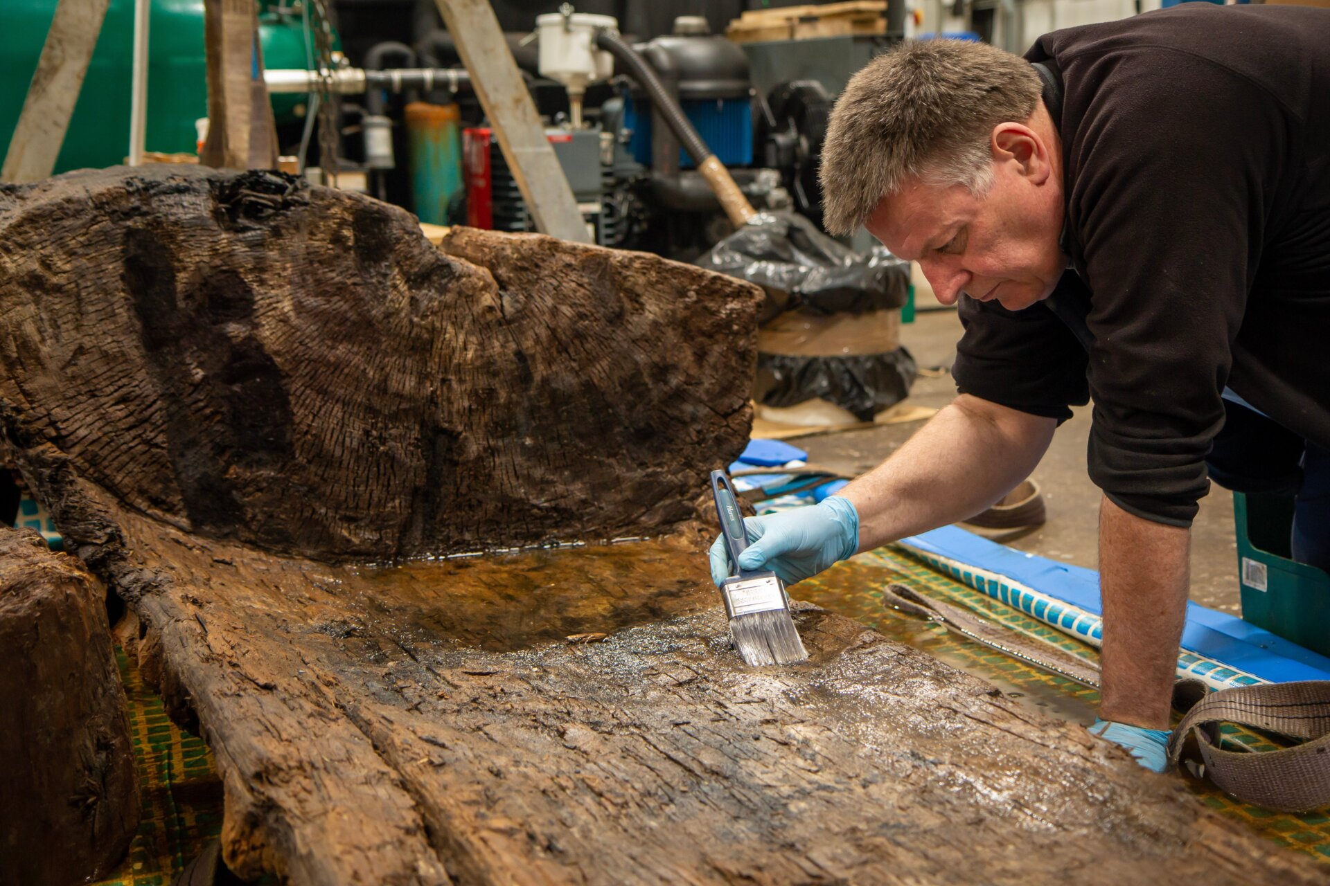 Ian Panter works on the 4,000-year-old oak coffin.