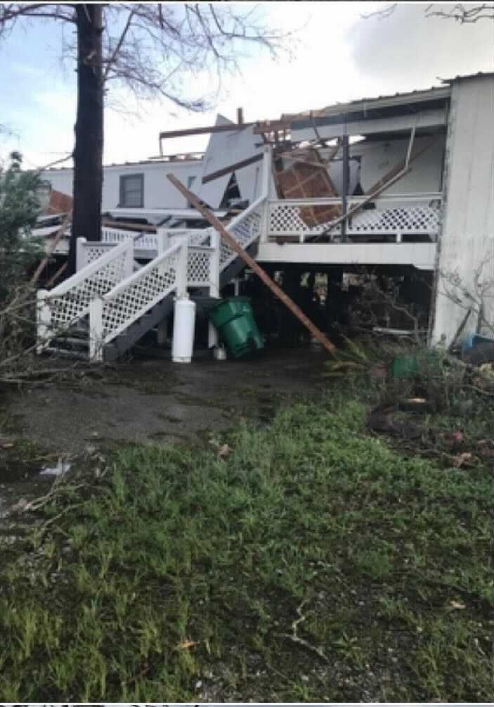 A destroyed home of a member of the Port-au-Chien Tribe.