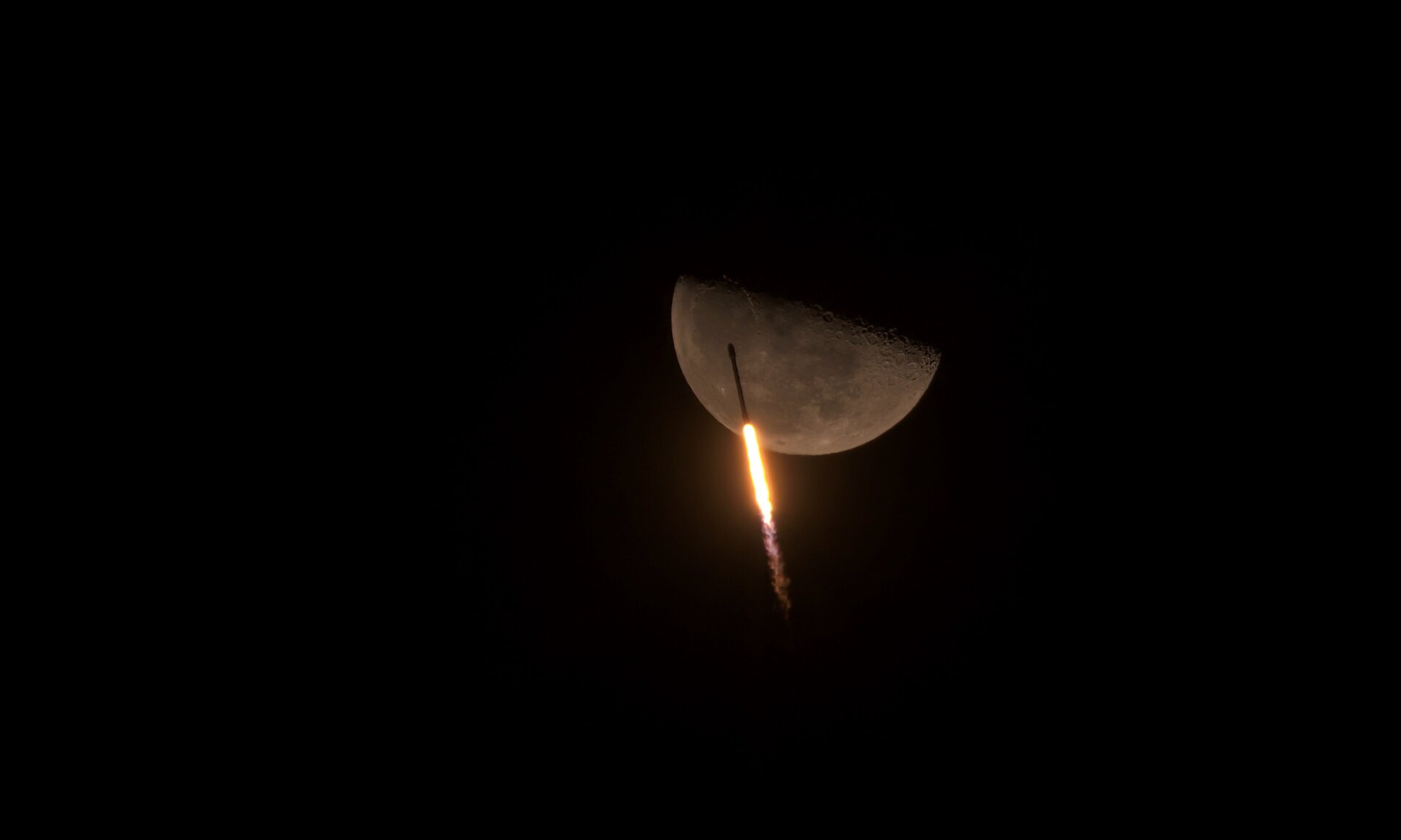 The Falcon 9 rocket launching across the moon in February 2021.