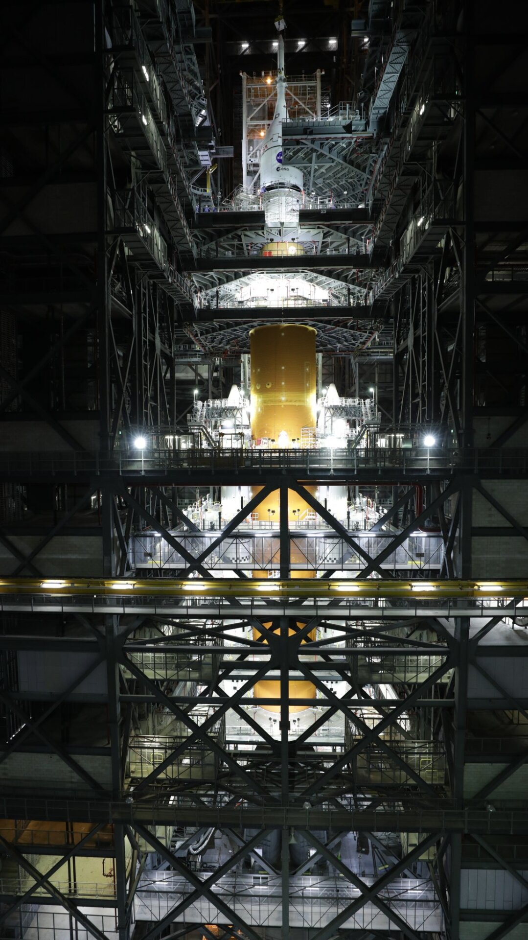 The fully stacked SLS rocket, as seen inside NASA’s Vehicle Assembly Building at Kennedy Space Center in Florida. 