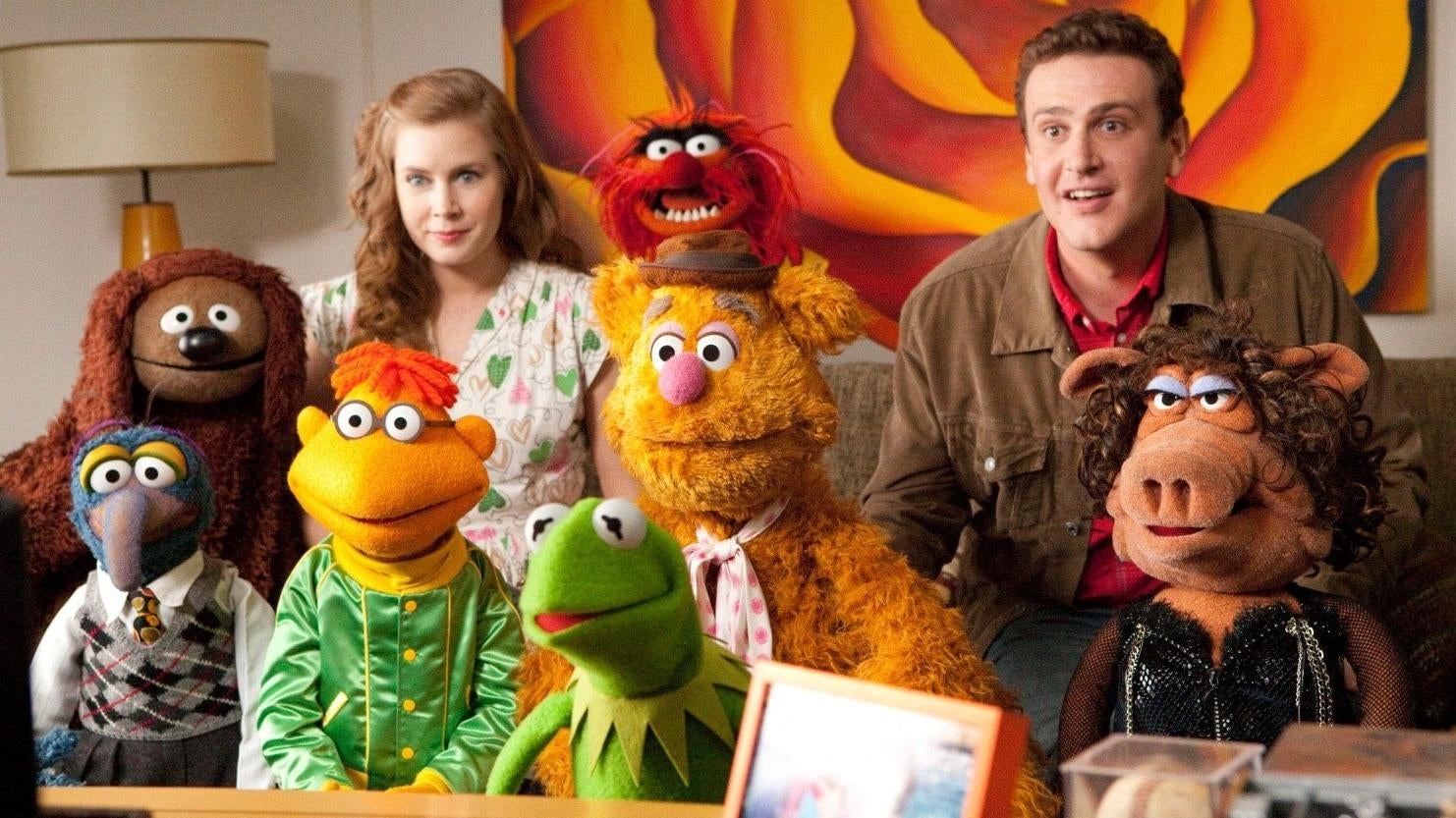 Amy Adams, Jason Segel, and the Muppets in The Muppets.