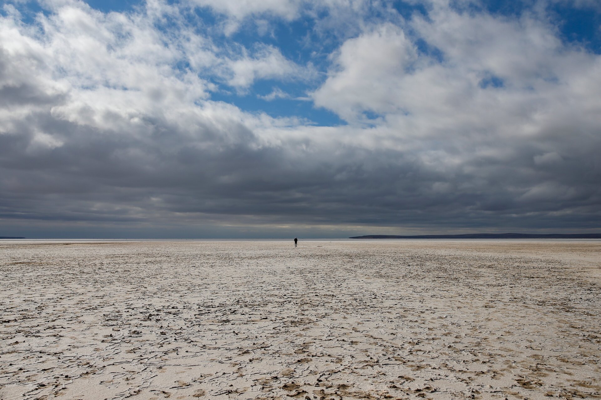 A man walks along Lake Tuz in Aksaray province, Turkey, Monday, Oct. 25, 2021. 
