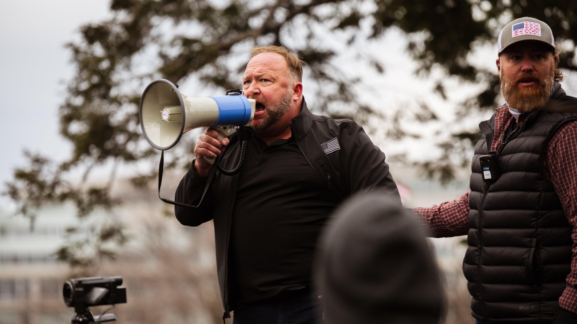 Alex Jones speaking outside the Capitol after Donald Trump supporters assaulted police and broke into the building en masse on Jan. 6, 2021.