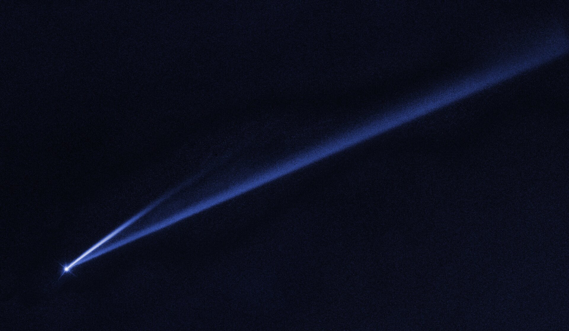 The asteroid Gault is the point at left, with streaks of dust stretching out half a million miles behind it.