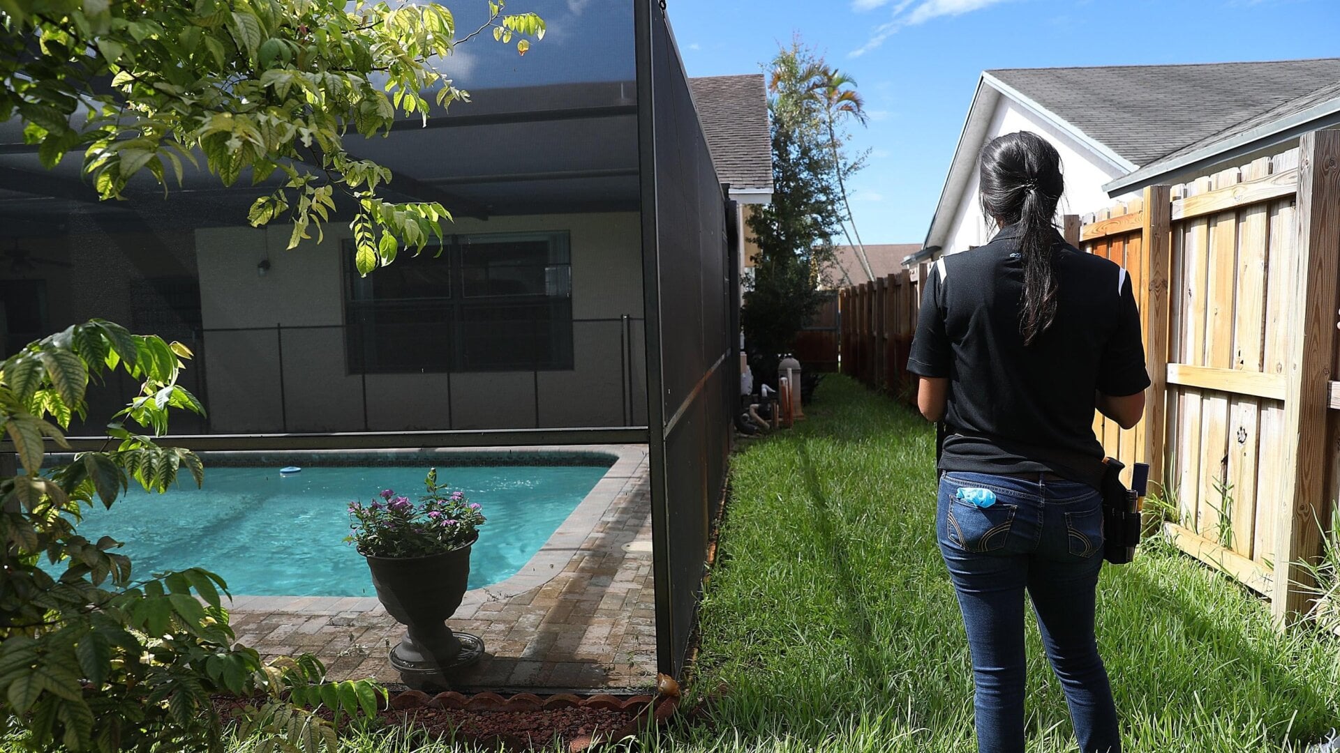 A Zillow home evaluator, Claudia Teyssandier, evaluating a home in Lauderhill, Florida in August 2019.
