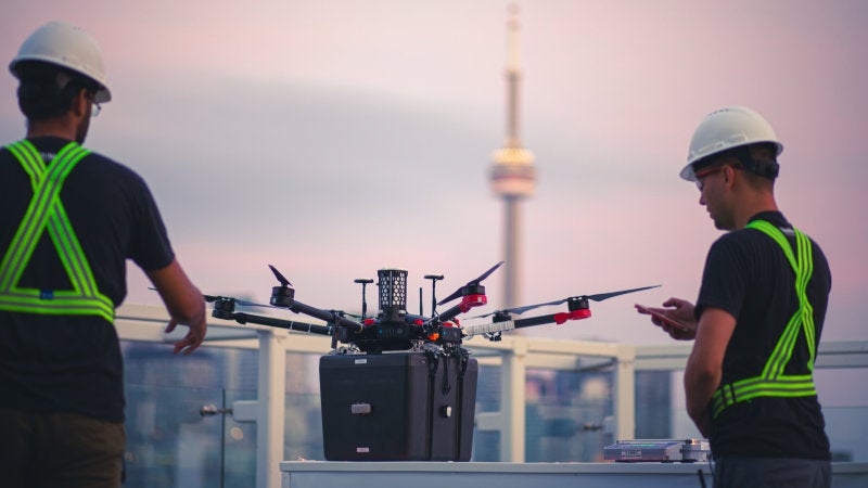 The drone during testing, with the CN Tower in the background. 