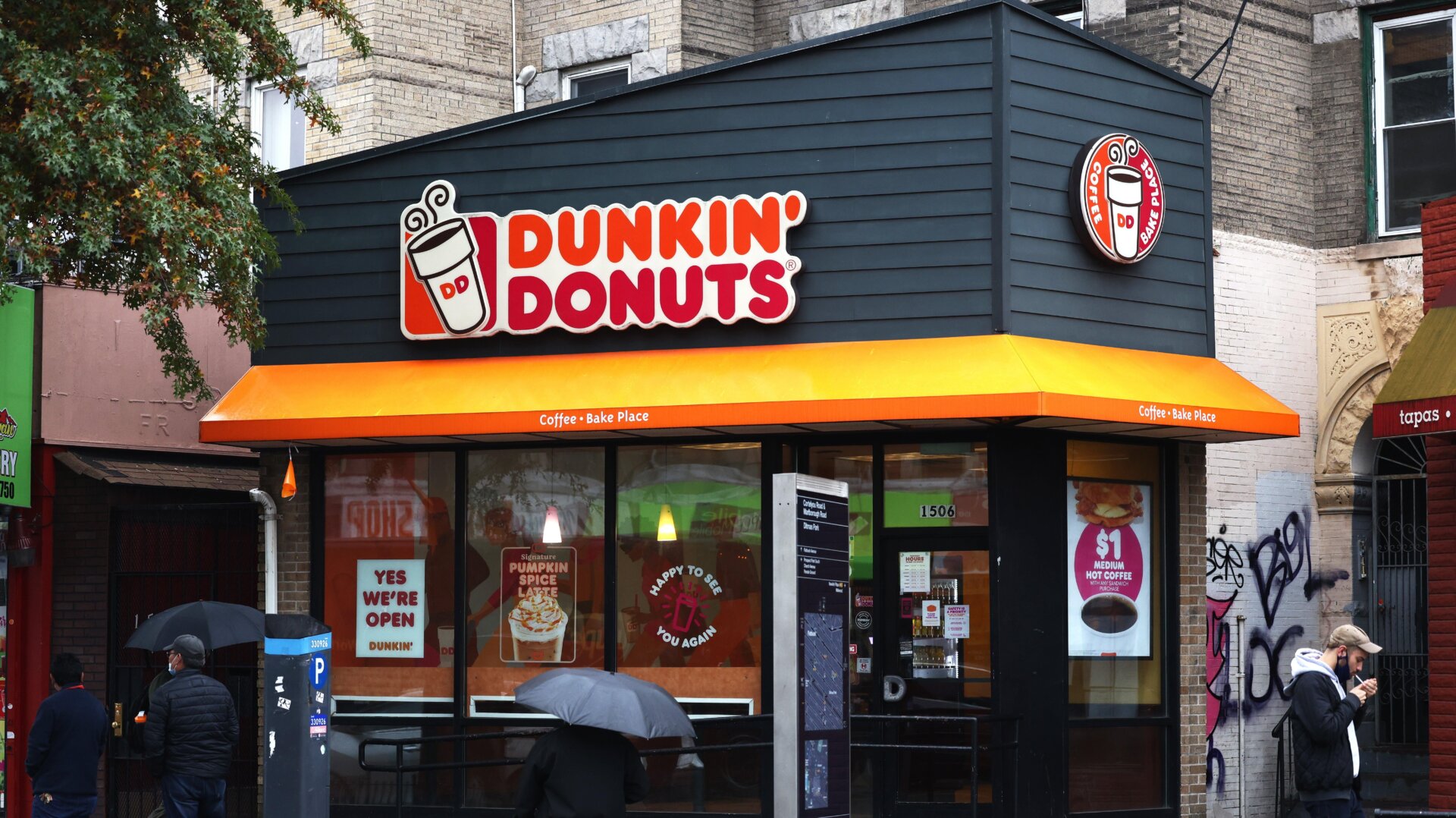 People walk past a Dunkin’ store on October 26, 2020 in New York City.