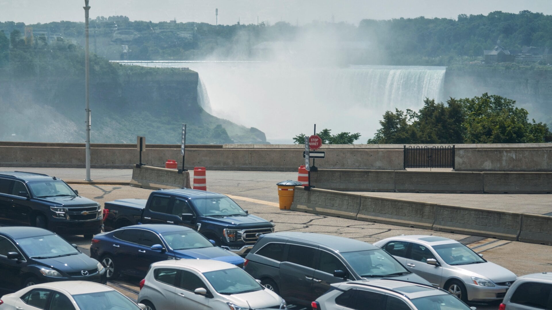Travelers wait to cross into Canada at the Rainbow Bridge in Niagara Falls, Ontario, August 9, 2021 as Canada reopened for nonessential travel to fully vaccinated Americans.