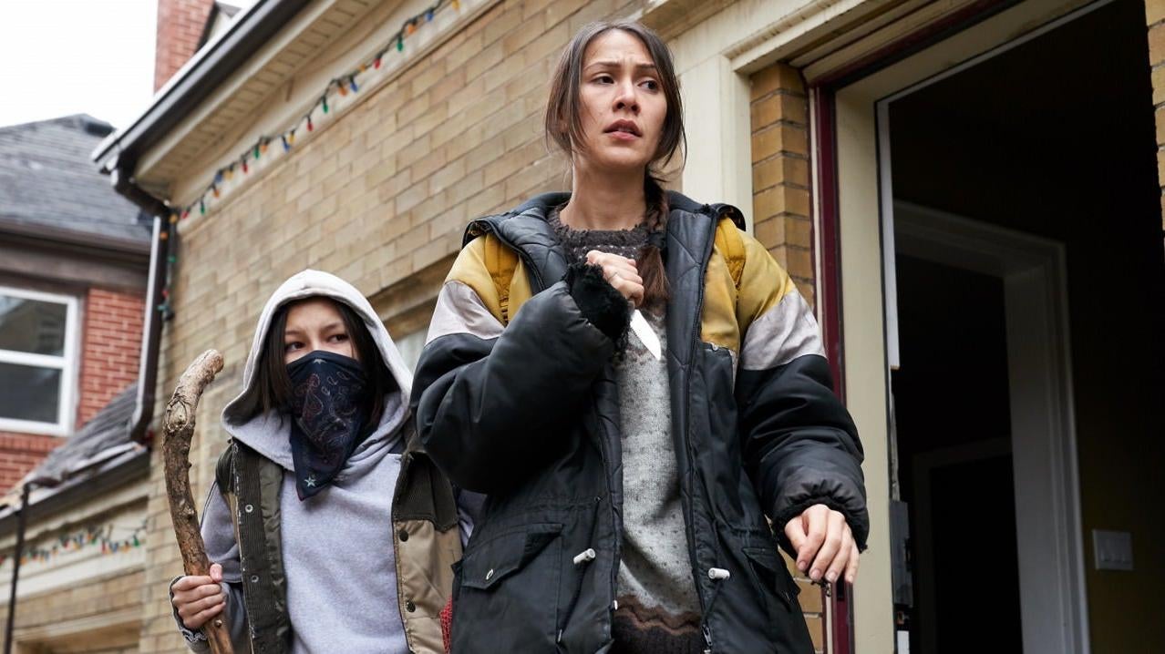 Niska (Elle-Maija Tailfeathers) prepares to defend her daughter Waseese (Brooklyn Letexier-Hart)