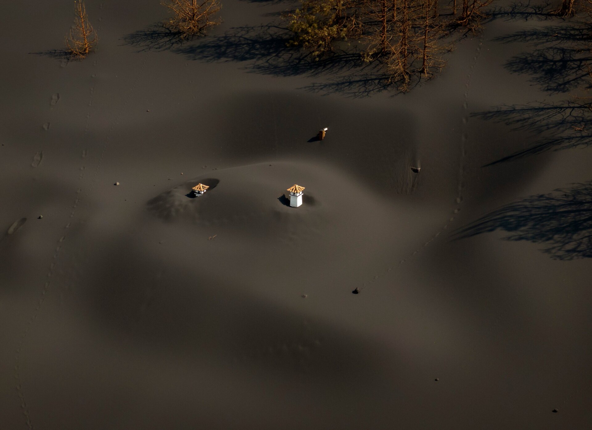 A house is covered by ash.