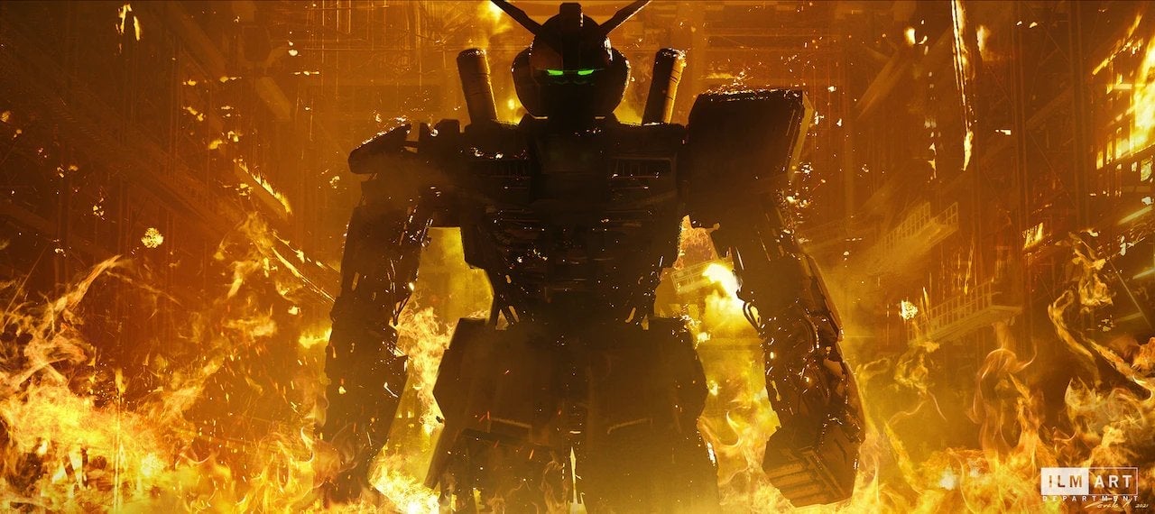 A giant Gundam robot strolls through fire.