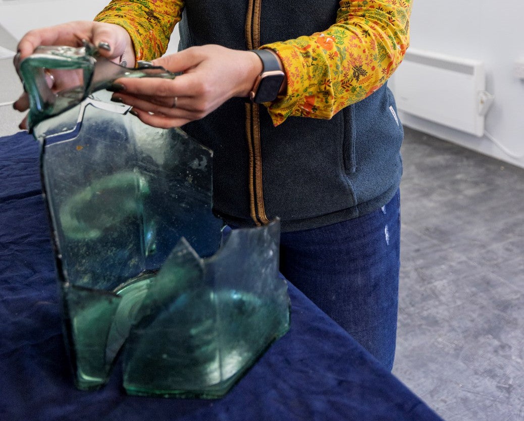 The hexagonal glass jug found at the site. 