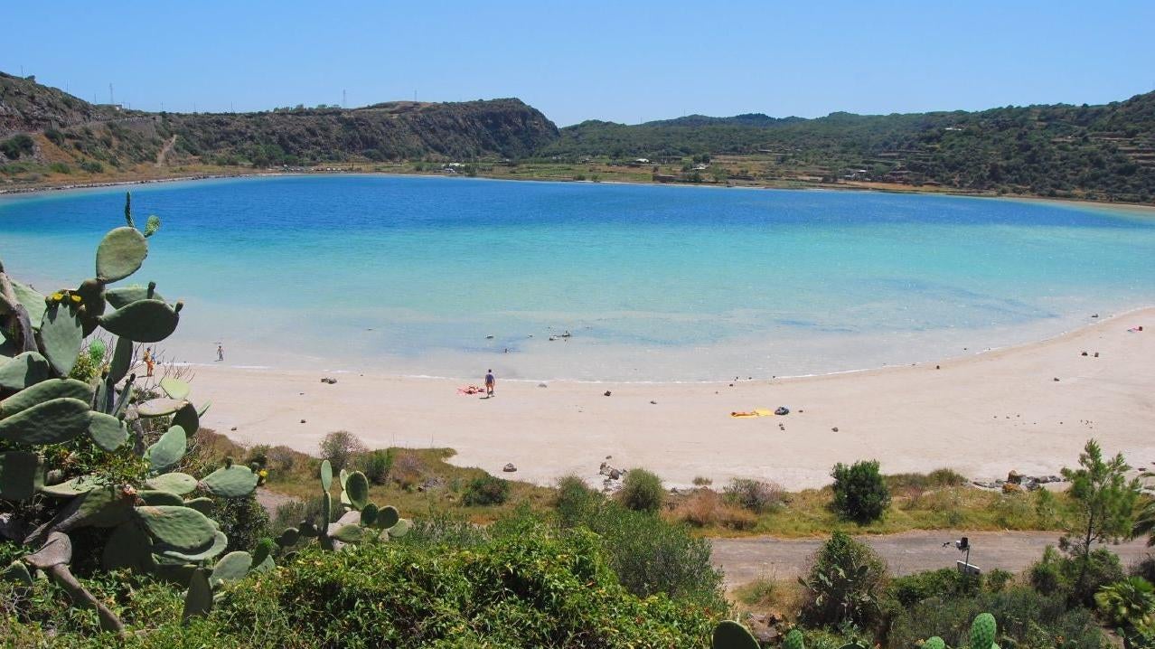 A photo of the Specchio di Venere on the Italian island of Pantelleria. The crater lake also contains natural hot springs that many tourists frequent.