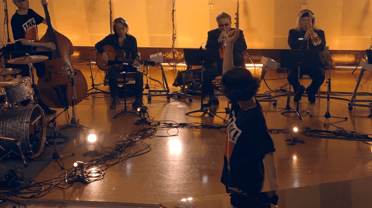 Yoko Kanno conducting her music for Cowboy Bebop.