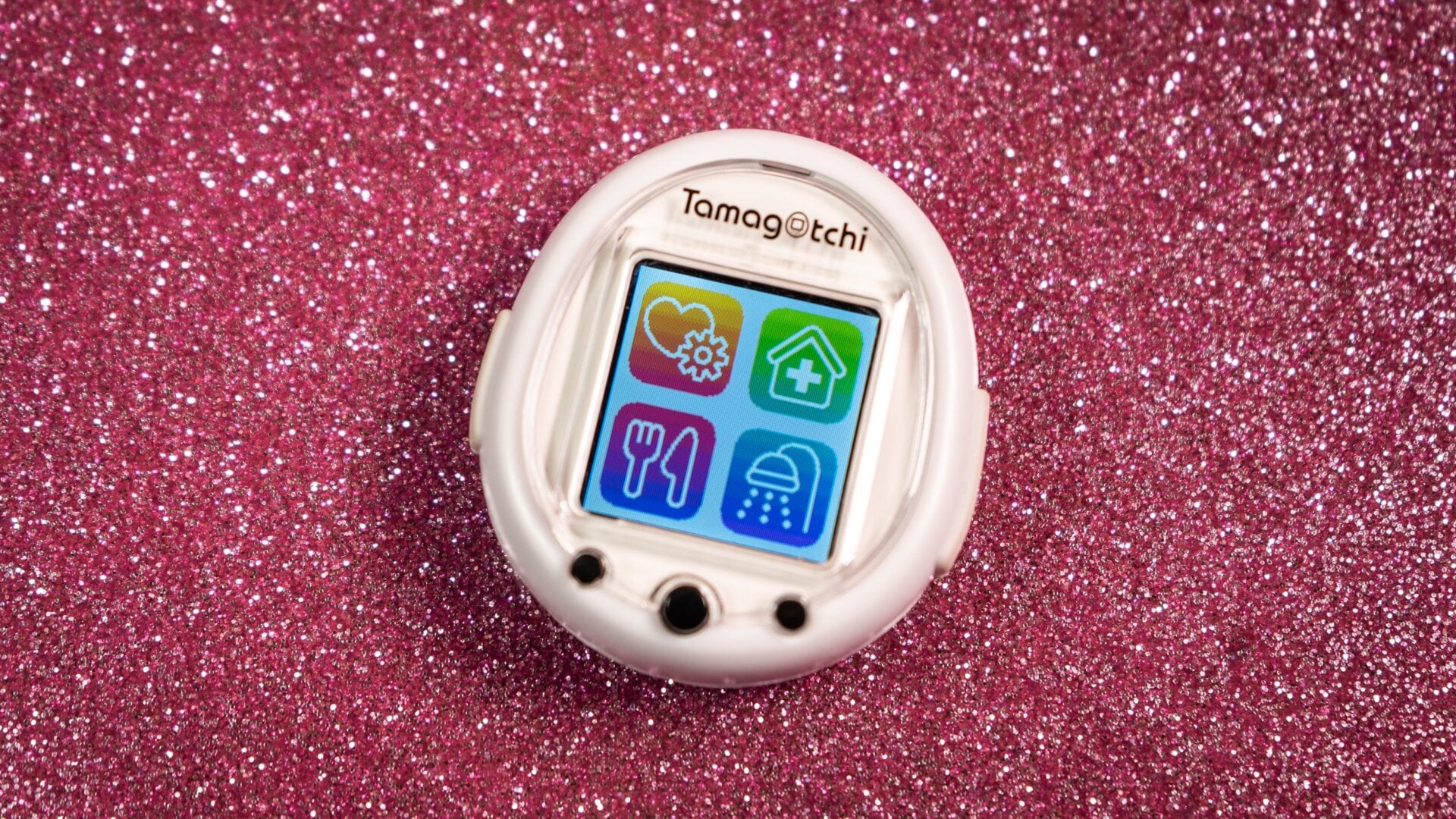 To choose a menu option on the Tamagotchi Smart, you tap the corner with the option rather than run through them with the physical buttons.