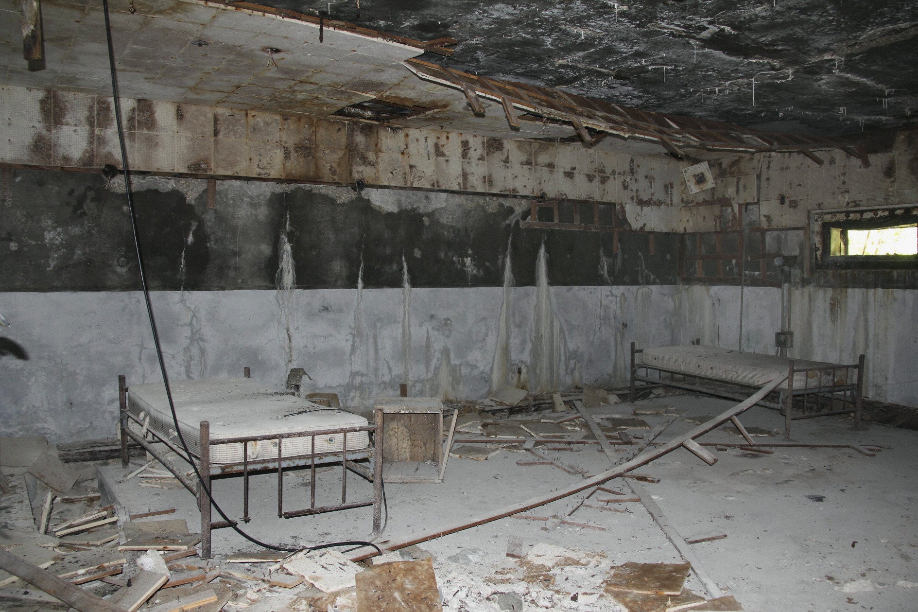 A ravaged room of an abandoned nuclear test observation post on Bikini Island.