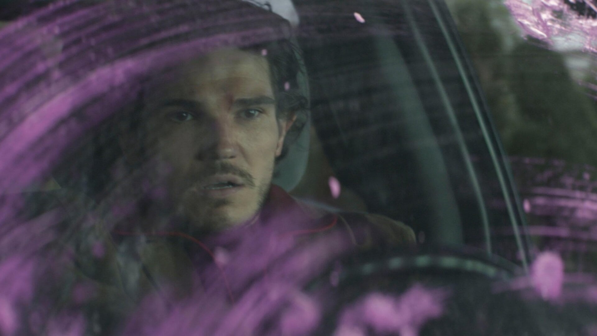 Maya’s man Kazi (Fra Fee) driving with Hawkeye putty.