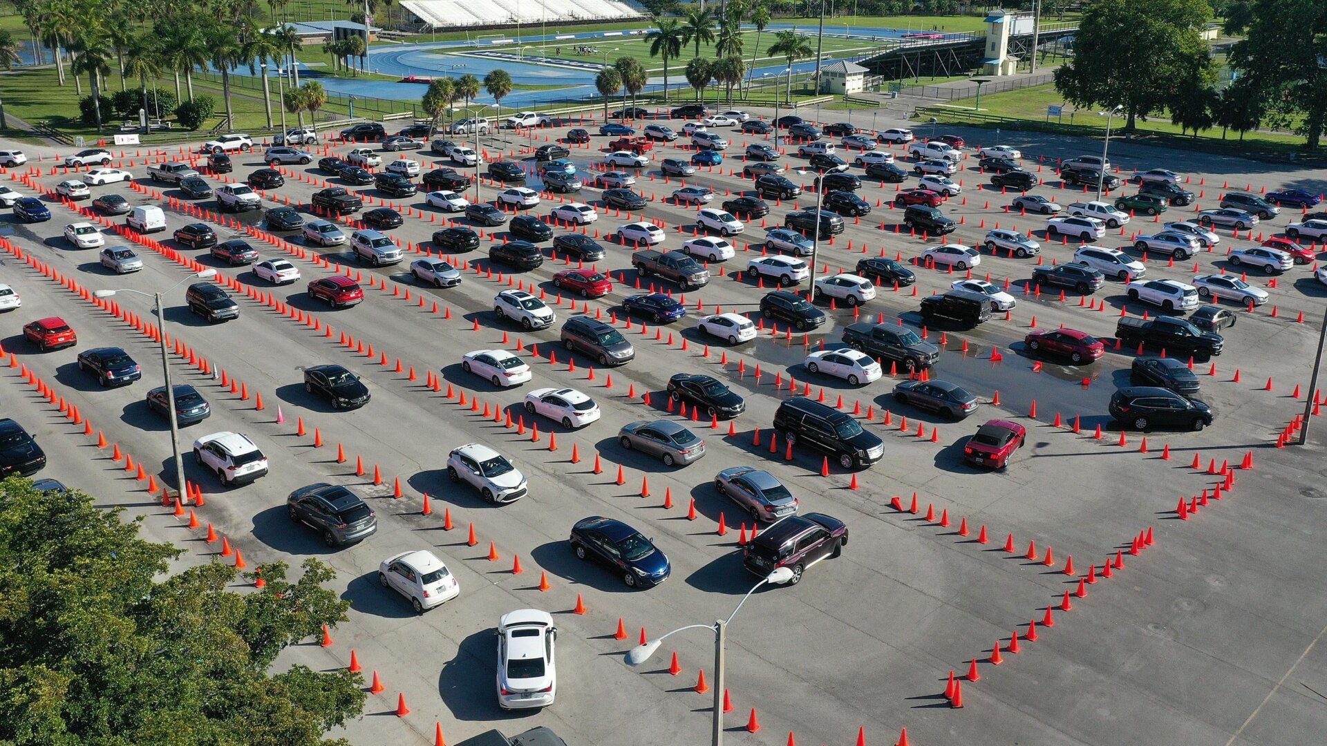 Cars line up at a drive through covid-19 testing site at Tropical Park on December 22, 2021 in Miami, Florida