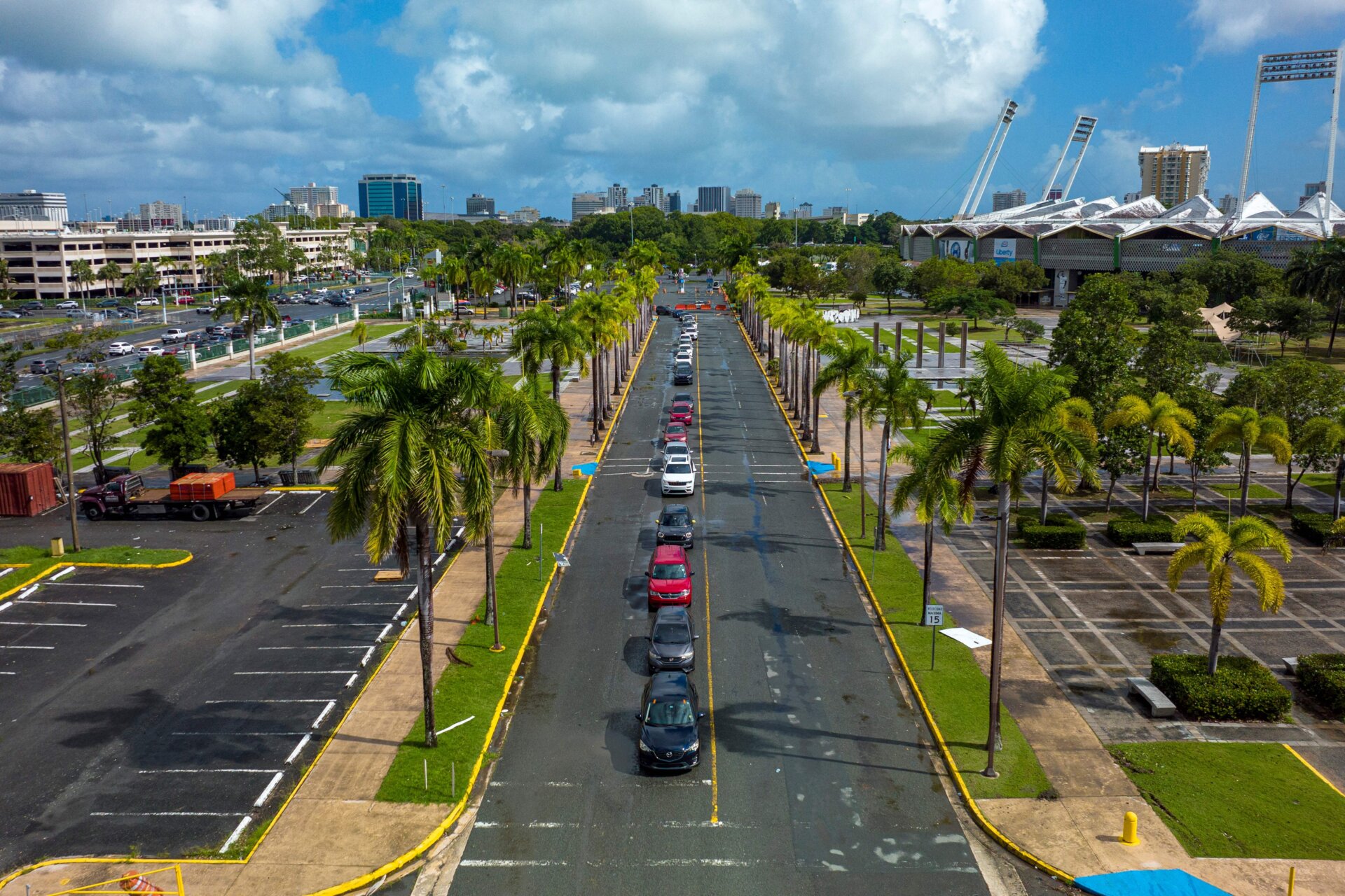 Drivers wait in line to be tested for covid-19, at a drive-up testing center operated by the Puerto Rico Health Department at the Hiram Bithorn Stadium parking lot, in San Juan, Puerto Rico, on December 18, 2021.