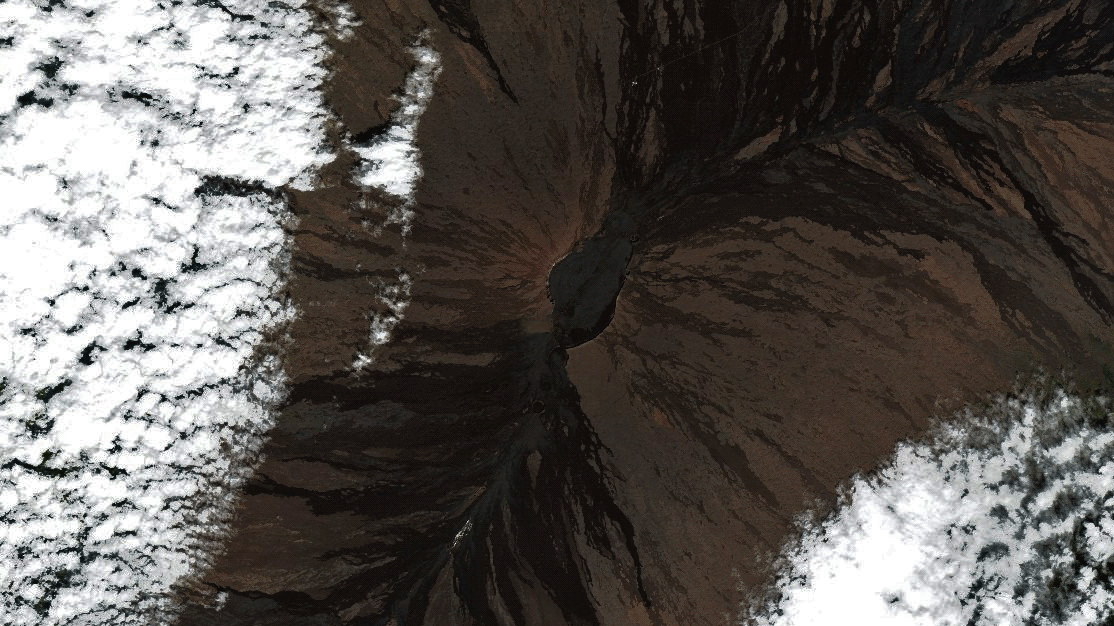 Before and after images show Mauna Loa covered in snow.