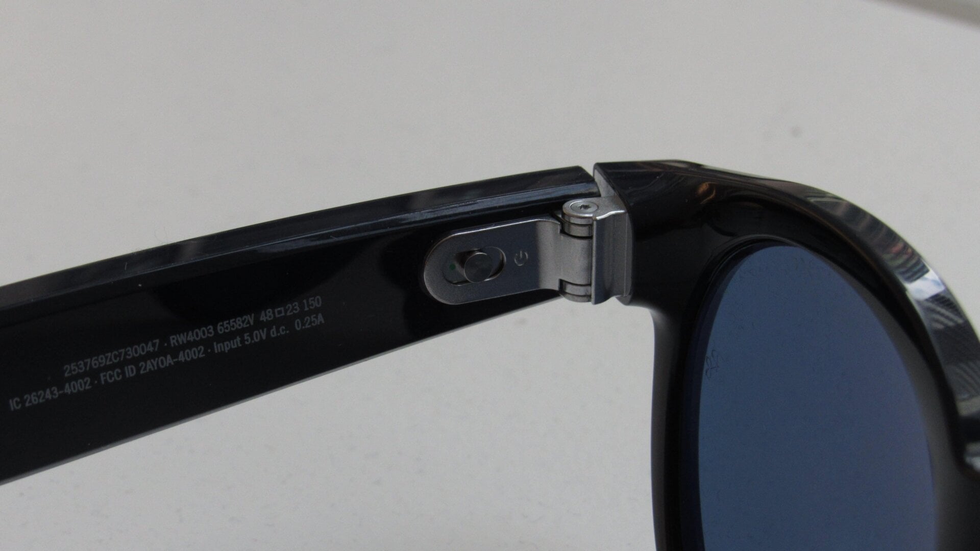 A tiny power switch on the left arm turns the Stories on and off.