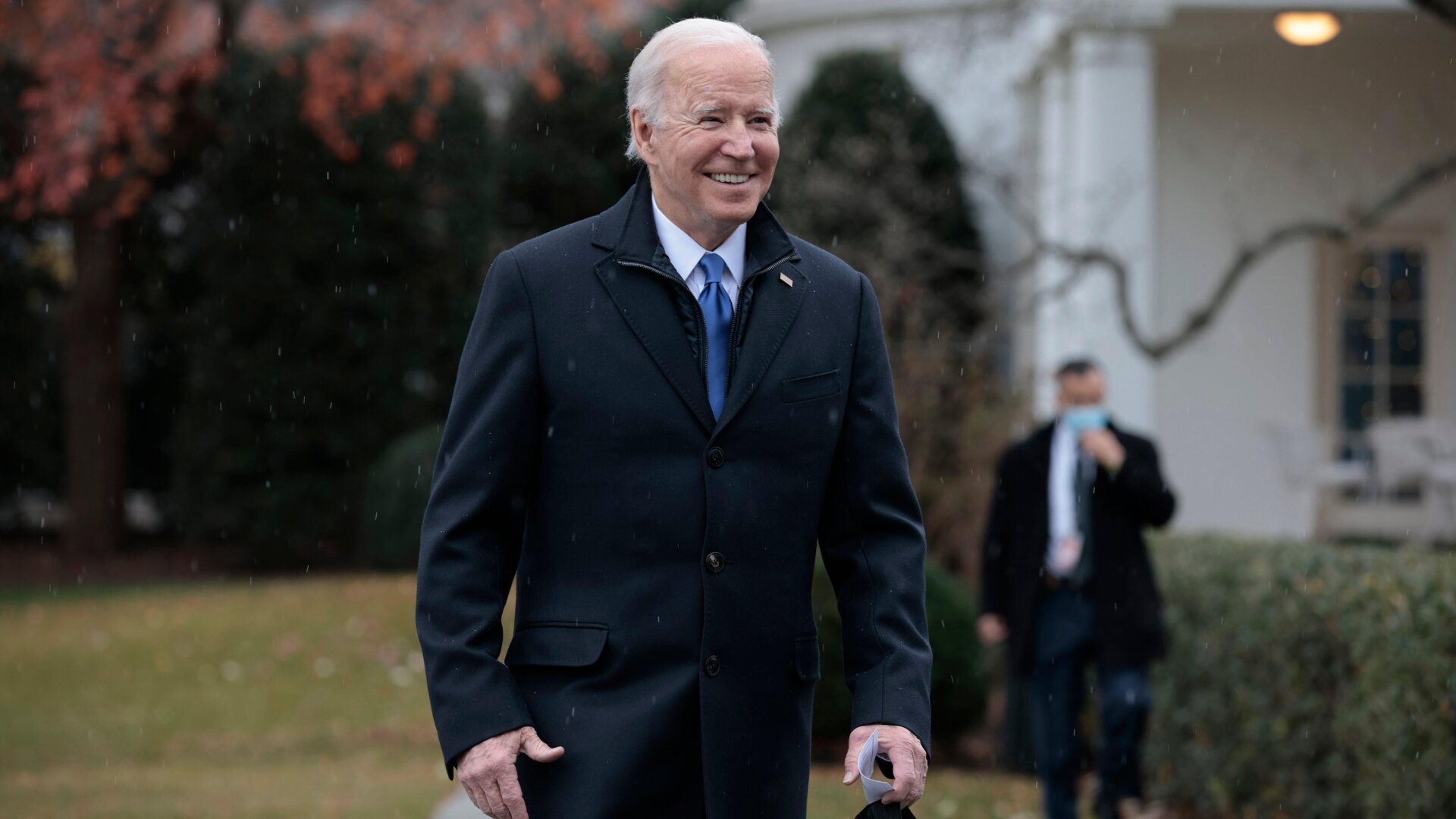 U.S. President Joe Biden walks over to reporters while departing the White House on December 8, 2021 in Washington, D.C.