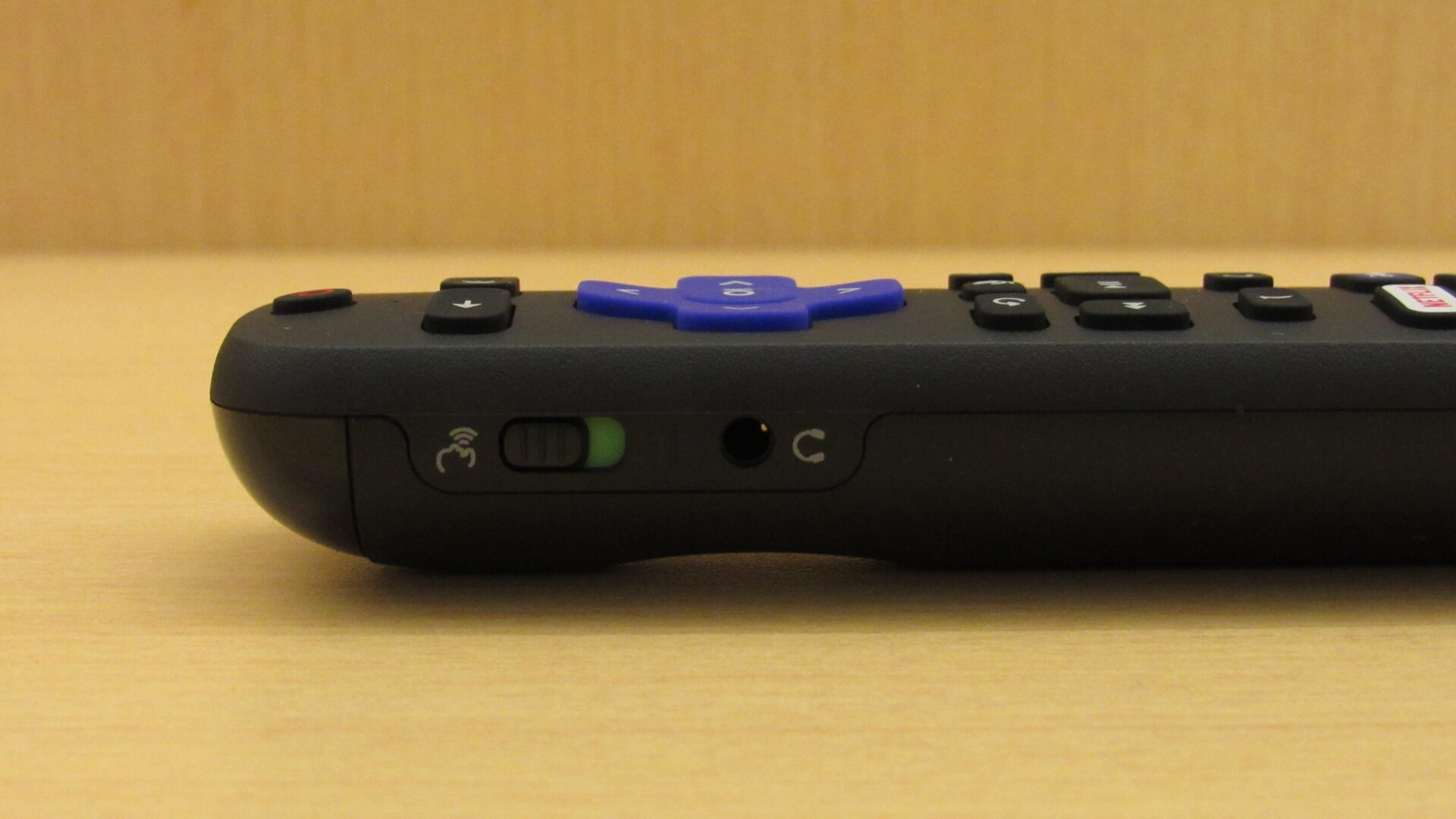 The Voice Remote Pro’s side profile, which includes a button to turn off the listening microphone.