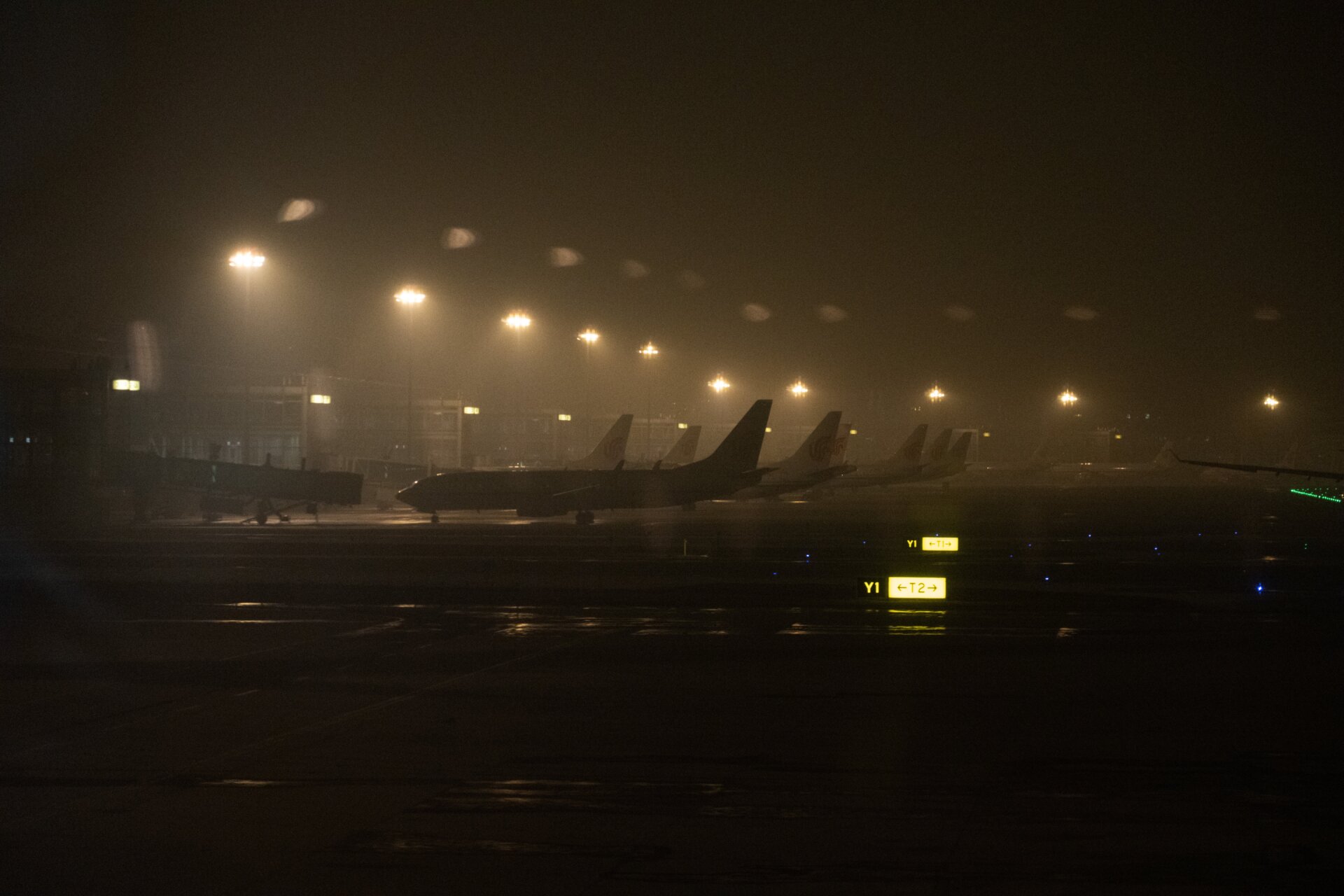 Planes are parked on the apron at Beijing Capital International Airport on January 24, 2022 in Beijing, China. With just over a week to go until the opening ceremony, final preparations are being made in Beijing ahead of the forthcoming 2022 Winter Olympics.
